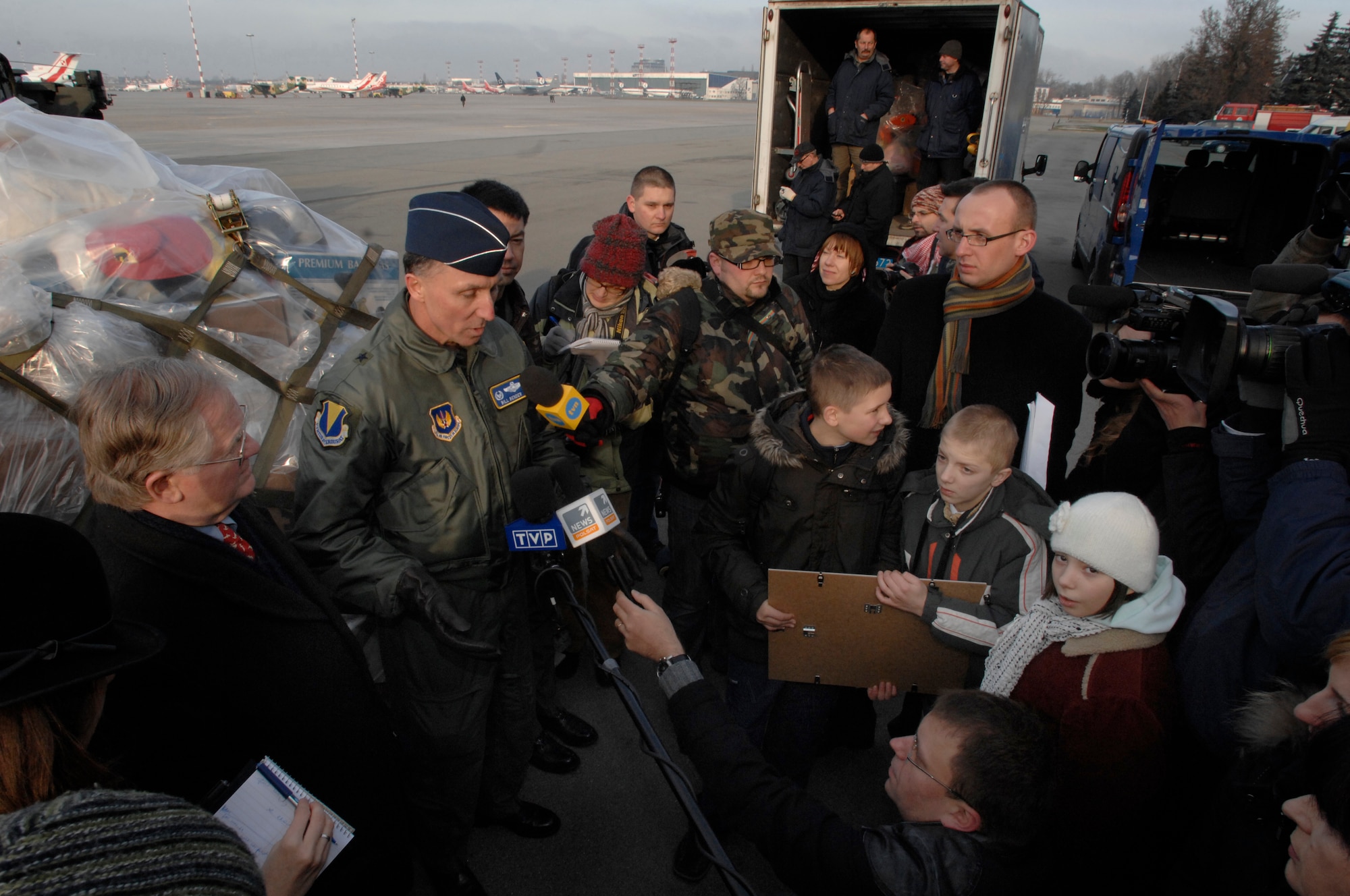 U.S. Air Force Brig. Gen. Bill Bender, 86th Airlift Wing and Kaiserslautern Military Community commander, is interviewed by Polish media members in Warsaw during a toy donation Jan. 28, 2009. The Kaiserslautern Military Community 5/6 Club gathered two pallets of toys that were donated to the My Home, My Future children's home in Slupsk, Poland. (U.S. Air Force photo by Senior Airman Amber Bressler)