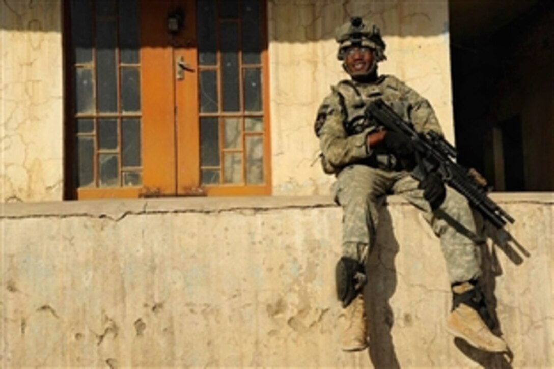 U.S. Army Cpl. Ronald Stewart takes a short break while visiting a Iraqi National Police Combat Outpost, in Mosul, Iraq, Feb. 4, 2009. Stewart and fellow soldiers are assigned to B Company, 3rd Brigade, 1st Cavalry Division.