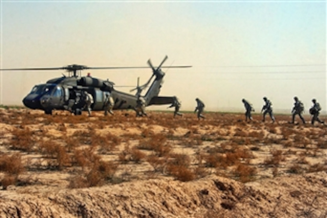 U.S. Army soldiers board a UH-60 Blackhawk helicopter after completing Operation Gunslinger Bonzai XXX in Hussaniyah Nahia, Iraq, Feb. 3, 2009. The soldiers are assigned to Company A, 1st Battalion, 27th Infantry Regiment, currently attached to the 82nd Airborne Division's 3rd Brigade Combat Team. The air-assault operation was conducted with Iraqi national police officers.
