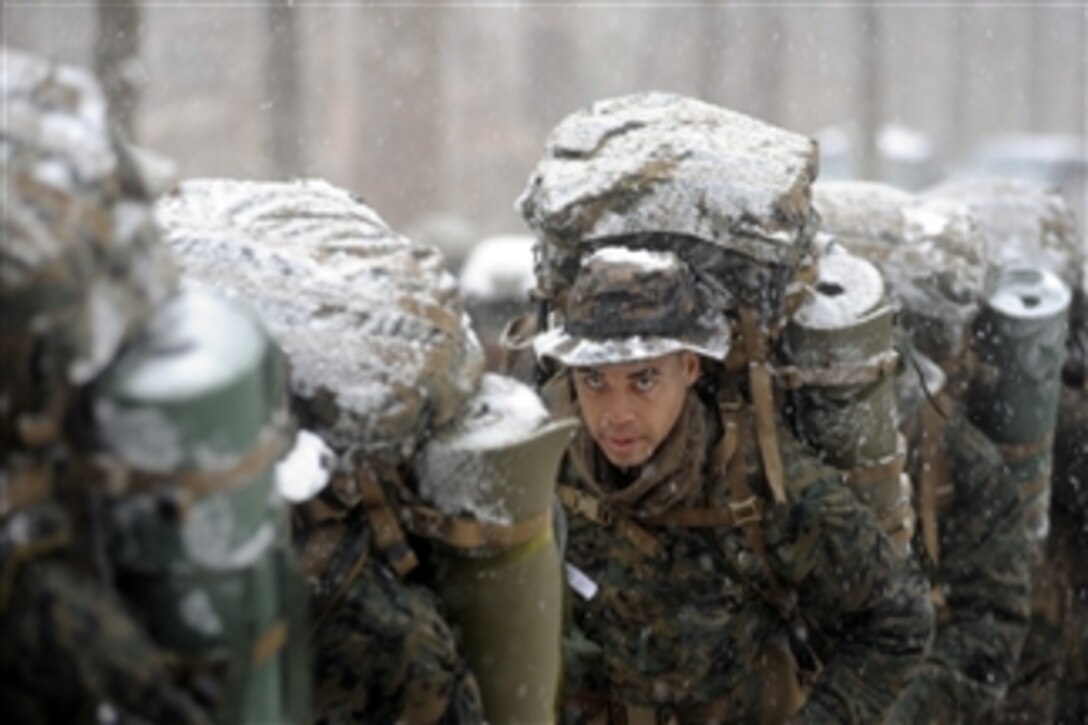 U.S. Marine Corps officer candidates from Charlie Company brave winter weather conditions during a four-mile hike at Marine Corps Base Quantico, Va., on Jan. 27, 2009.  Candidates are evaluated on their leadership abilities and problem solving skills.  