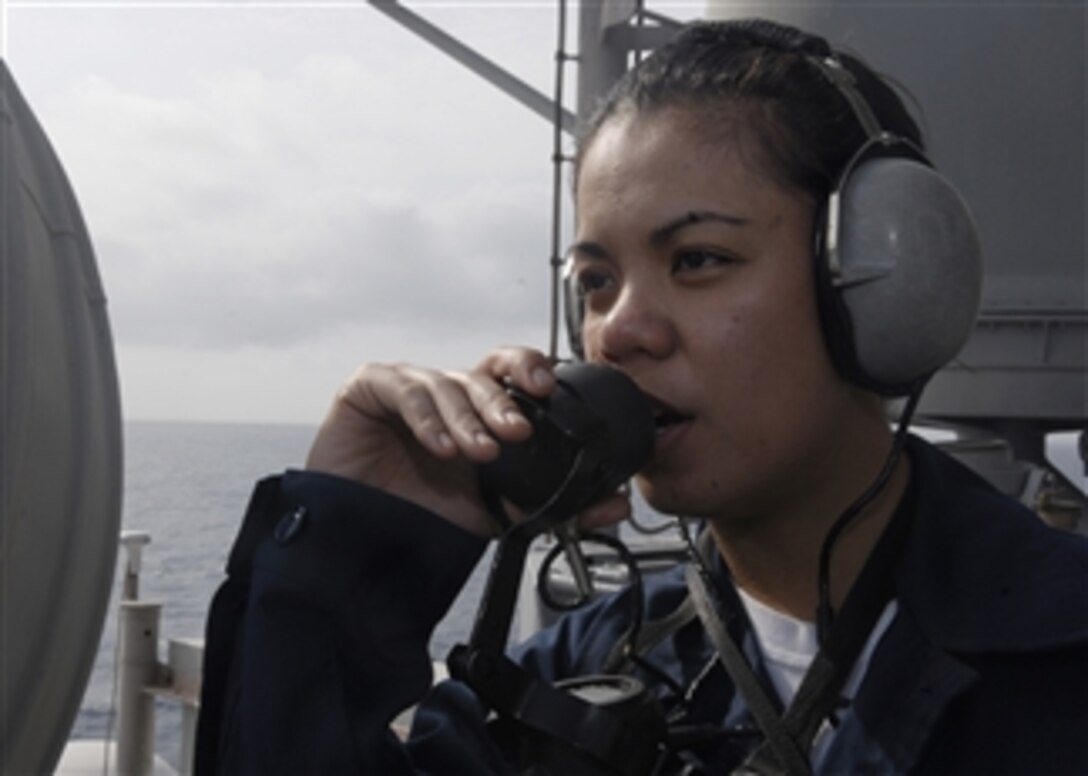 U.S. Navy Seaman Joan Clarice Santiago reports air contacts while serving as forward lookout aboard the amphibious assault ship USS Essex (LHD 2) underway in the South China Sea on Feb. 4, 2009.  The Essex is the lead ship of the only forward-deployed U.S. Expeditionary Strike Group and the flagship of Command Task Force 76.  