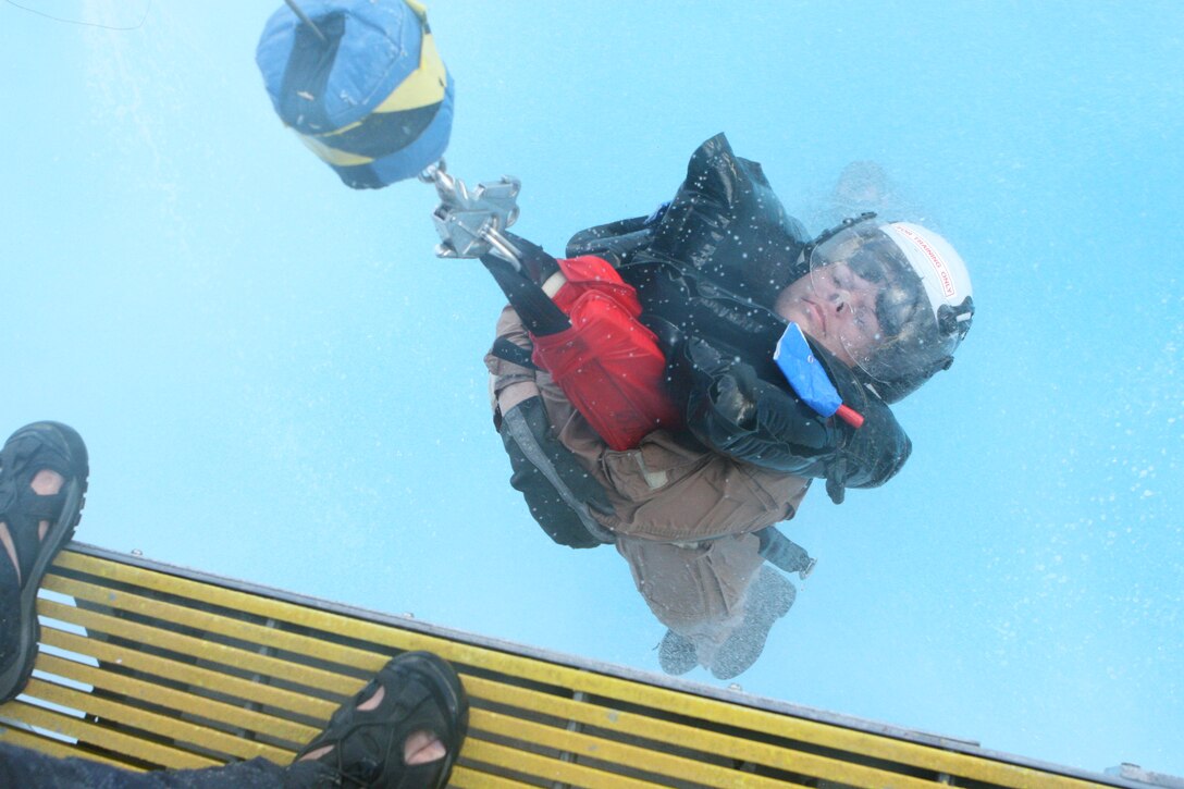 A future Department of Defense leader is hoisted out of water at the Aviation Survival Training Center at Marine Corps Air Station Miramar, Feb 9. Civilian and military participants of the Executive Leadership Development Program receive training similar to the training aircrew receive.