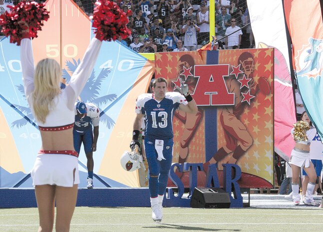 Kurt Warner waves to the 50,000 in attendance at the NFL Pro Bowl Sunday as he and the rest of the NFC Champion Arizona Cardinals were introduced. Warner was the starting quaterback for the NFC team.
