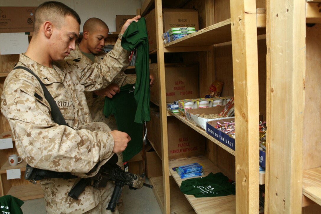 Marines with Regimental Combat Team 8 inspect the newly donated items at the chapel annex here. Marines and sailors enjoy the ability to leisurely stroll through the well organized store, sifting through free hygiene items and other donated goods.