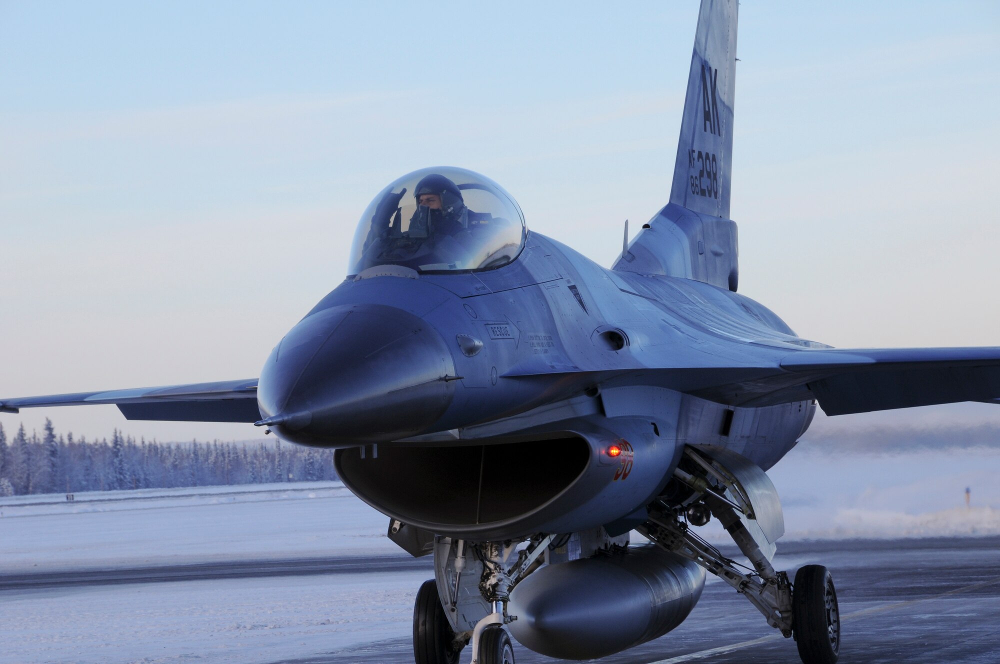 Captain Chris Lehto signals from his aircraft prior to take-off Feb. 5, 2009 at Eielson Air Force Base, Alaska. Capt. Lehto is about to fly an F-16 Fighting Falcon over the Pacific Alaskan Range Complex which provides approximately 67,000 square miles of air space. Capt. Lehto is a pilot with the 18th Aggressors Squadron.(U.S. Air Force photo/Airman 1st Class Laura Max)