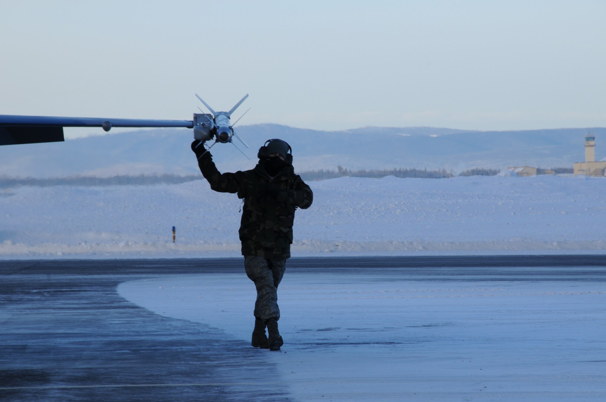 Airman Adam Marks checks to see if all is secure with the launcher on Feb. 5, 2009 at Eielson Air Force Base, Alaska. The aircraft maintenance crew performs final checks on the F-16 Fightingt Falcon on the end of the runway to ensure safety. Airman Marks is an armament systems apprentice, 354th Aircraft Maintenance Squadron. (U.S. Air Force photo/Airman 1st Class Laura Max)