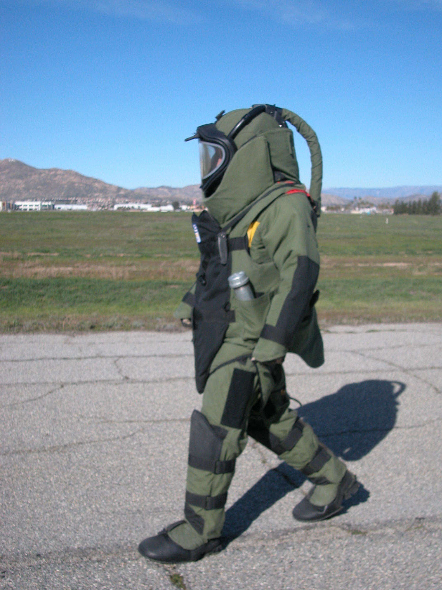 Tech. Sgt. Chris Campbell walks in full EOD-8 apparel. The 55-pound suit is used to help protect him in case an IED detonates. (U.S Air Force photo by Staff Sgt. Megan Crusher)