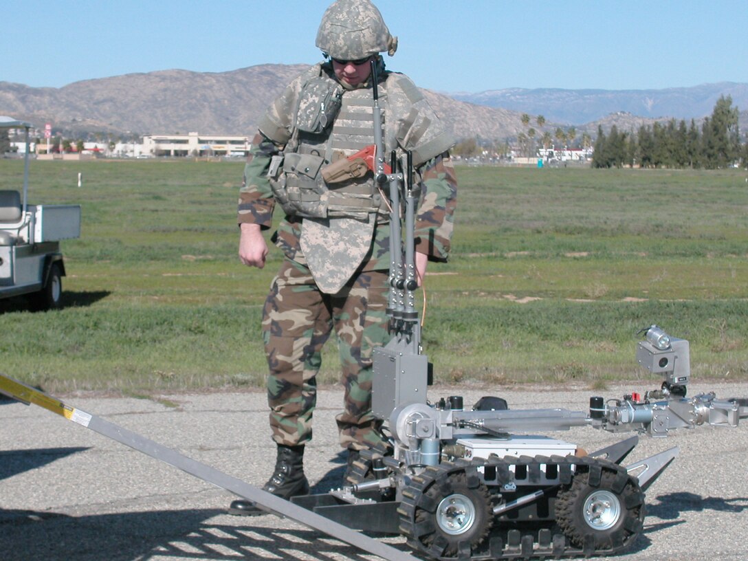 Tech. Sgt. Chris Campbell, a team chief at 452 CES/EOD, prepares to deploy the HD-1 to deal with the threat of an IED. Members of EOD nicknamed the robot “Wall-E,” after the recent movie. They nicknamed a second robot “Johnny 5.” (U.S Air Force photo by Staff Sgt. Megan Crusher)