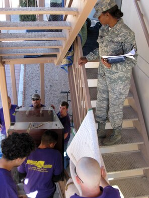 NELLIS AIR FORCE BASE, Nev. -- Tech. Sgt. Vickie Sennet, 926th Mission Support Squadron, oversees a move into the 926th Group's temporary facility Feb. 3. The U.S. Air Force Reserve group is an associate unit to the United States Air Force Warfare Center here, whose personnel help ensure deployed forces are well-trained and well-equipped to conduct integrated combat operations by certifying equipment, developing tactics, and providing premiere education and exercise venues. The 226-strong, and rapidly growing, unit is scheduled to move into its permanent facility here in Sept. 2009.