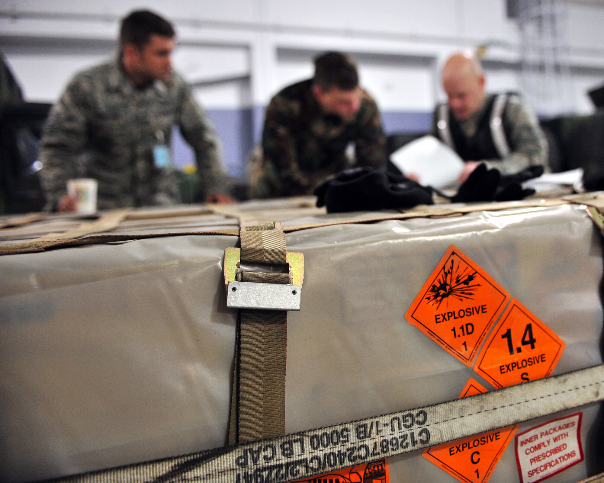Staff Sgt. Scott Berrier, 354th Logistics Readiness Squadron, reviews last minute paperwork at the explosive ordnance disposal building Feb. 9, 2009 during an operational readiness exercise. Each piece of cargo must be filed before it is loaded into the joint mobility complex.  (U.S Air Force photo/Airman 1st Class Willard E. Grande II)