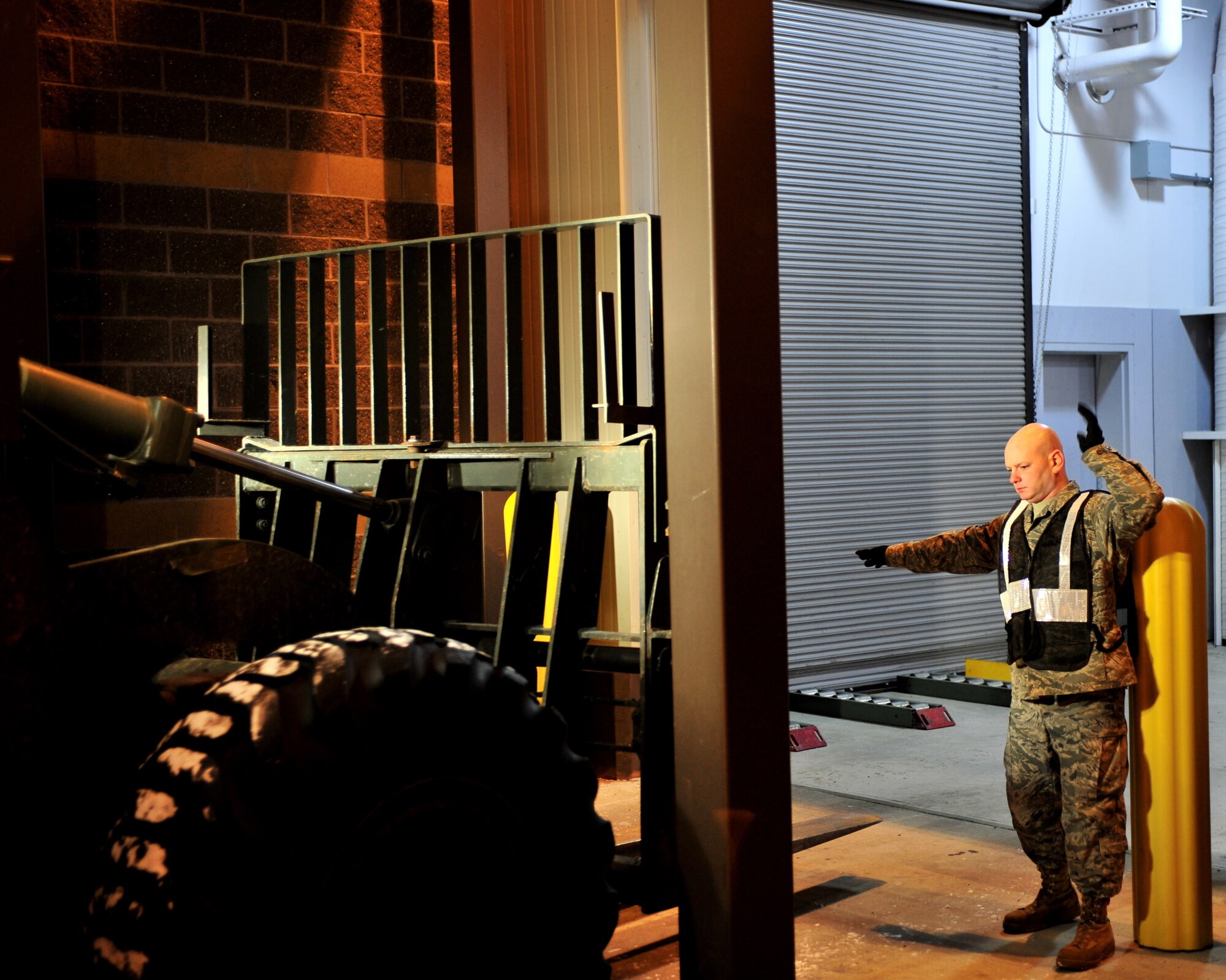 Staff Sgt. Scott Berrier, 354th Logistics Readiness Squadron, directs a forklift during an operational readiness exercise Feb. 9, 2009. The way cargo is prepared during an ORE is no different than during an actual deployment. (U.S Air Force photo/Airman 1st Class Willard E. Grande II)