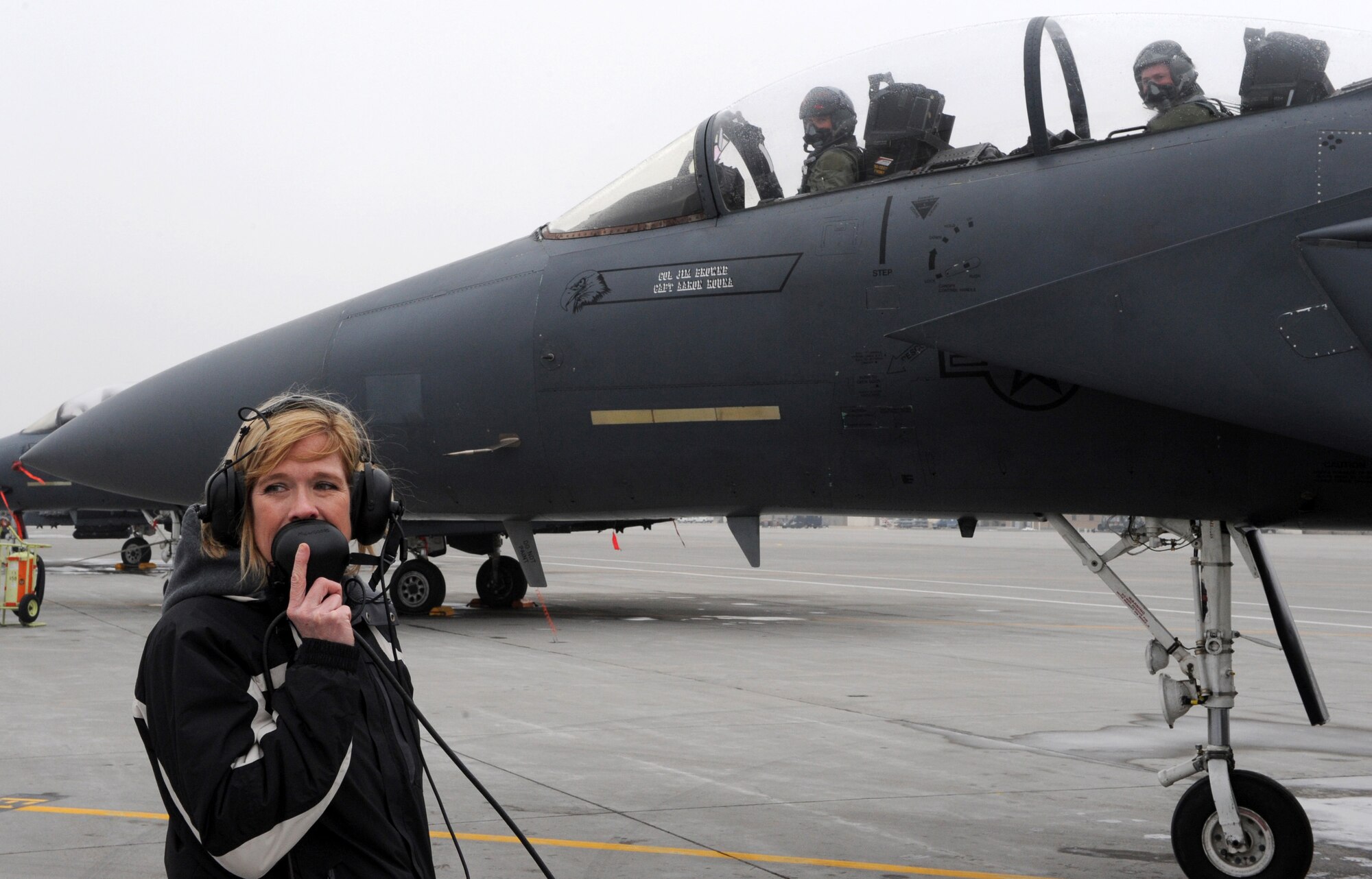 MOUNTAIN HOME AIR FORCE BASE, Idaho -- Alison Browne talks to her husband Col. James Browne, 366th Fighter Wing commander, over a radio before he takes his final flight in an F-15 as Gunfighter One Feb. 9. Colonel Browne was recently selected for an assignment at the Pentagon in Washington D.C. (U.S. Air Force photo/Airman 1st Class Debbie Lockhart)