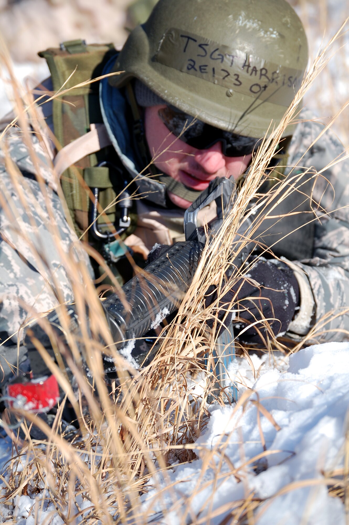Tech. Sgt. James Harrison, a student in the Advanced Contingency Skills Training Course responds to a scenario during a training session in combat first aid on Feb. 5, 2009, on a Fort Dix, N.J., range.  ACST is taught by the U.S. Air Force Expeditionary Center's 421st Combat Training Squadron and prepares Airmen for upcoming deployments.  (U.S. Air Force Photo/Tech. Sgt. Scott T. Sturkol)