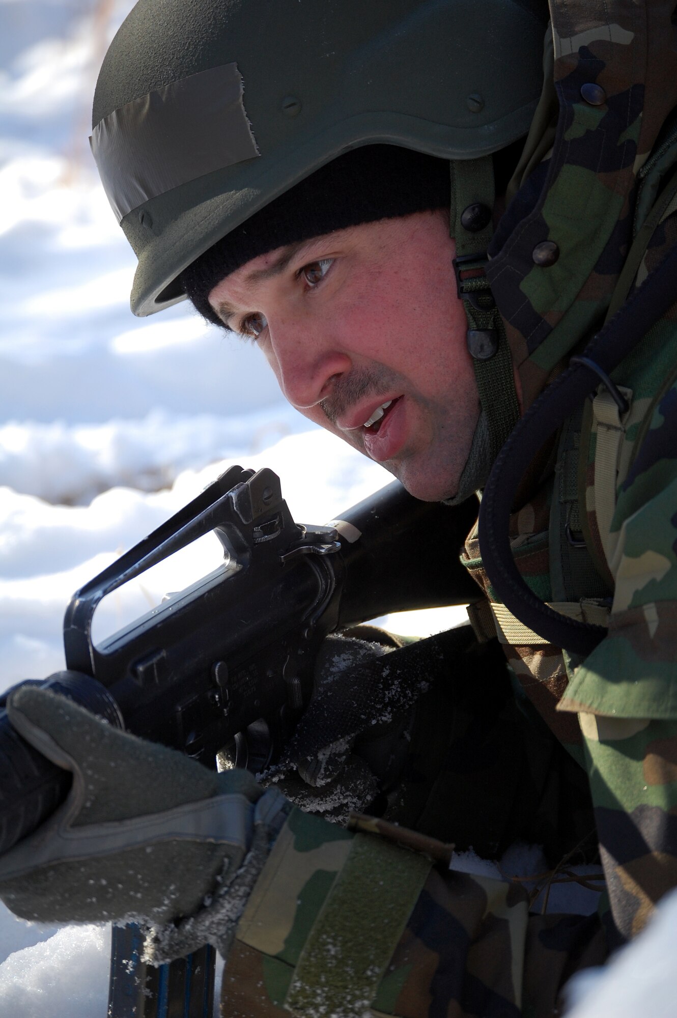A student in the Advanced Contingency Skills Training Course responds to a scenario during a training session in combat first aid on Feb. 5, 2009, on a Fort Dix, N.J., range.  ACST is taught by the U.S. Air Force Expeditionary Center's 421st Combat Training Squadron and prepares Airmen for upcoming deployments.  (U.S. Air Force Photo/Tech. Sgt. Scott T. Sturkol)