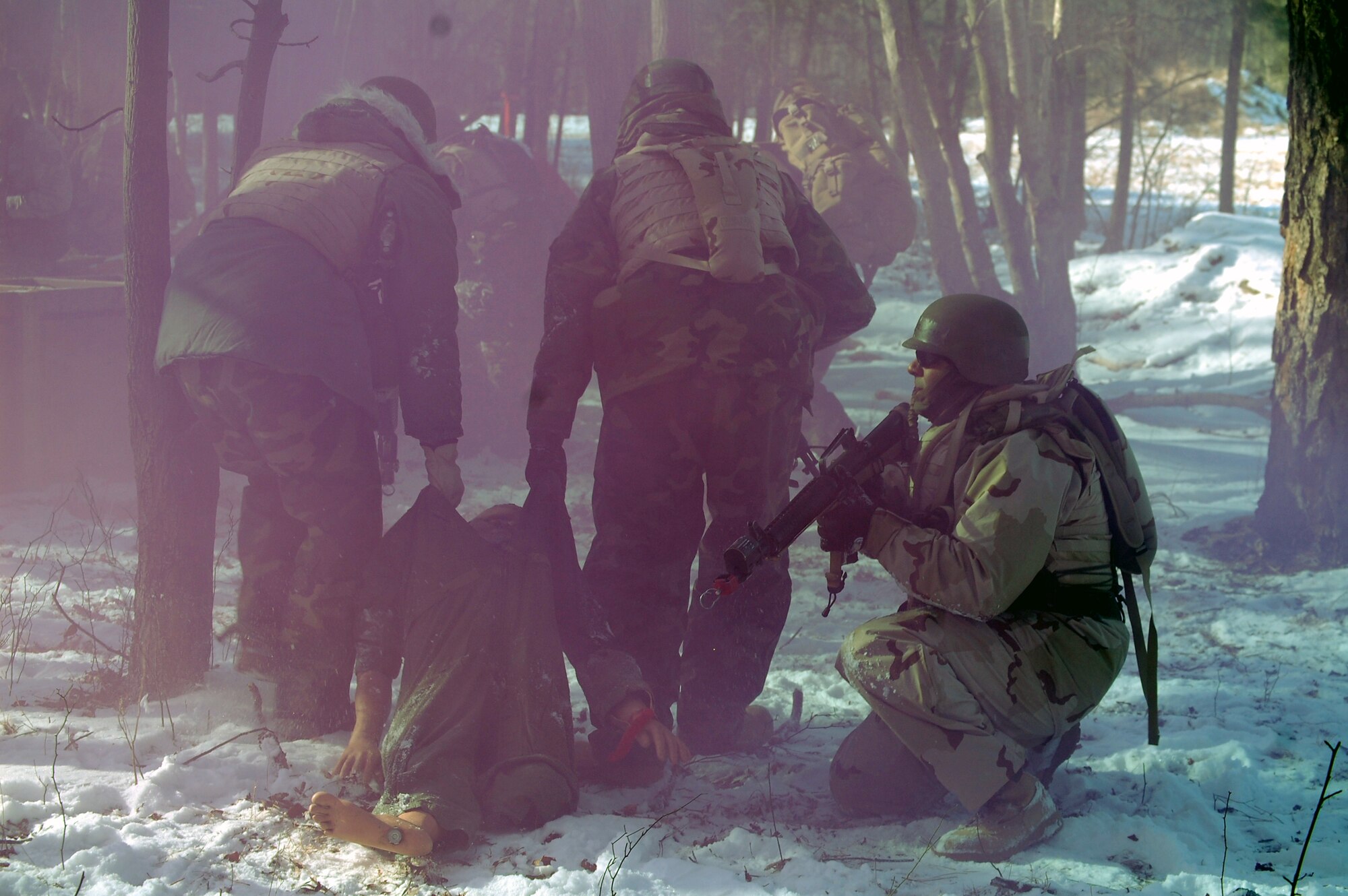 Students in the Advanced Contingency Skills Training Course respond to a scenario during a training session in combat first aid on Feb. 5, 2009, on a Fort Dix, N.J., range.  ACST is taught by the U.S. Air Force Expeditionary Center's 421st Combat Training Squadron and prepares Airmen for upcoming deployments.  (U.S. Air Force Photo/Tech. Sgt. Scott T. Sturkol)