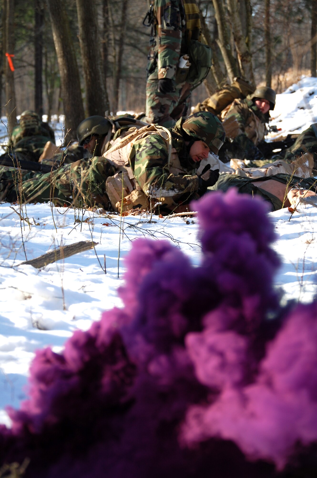 Students in the Advanced Contingency Skills Training Course respond to a scenario during a training session in combat first aid on Feb. 5, 2009, on a Fort Dix, N.J., range.  ACST is taught by the U.S. Air Force Expeditionary Center's 421st Combat Training Squadron and prepares Airmen for upcoming deployments.  (U.S. Air Force Photo/Tech. Sgt. Scott T. Sturkol)