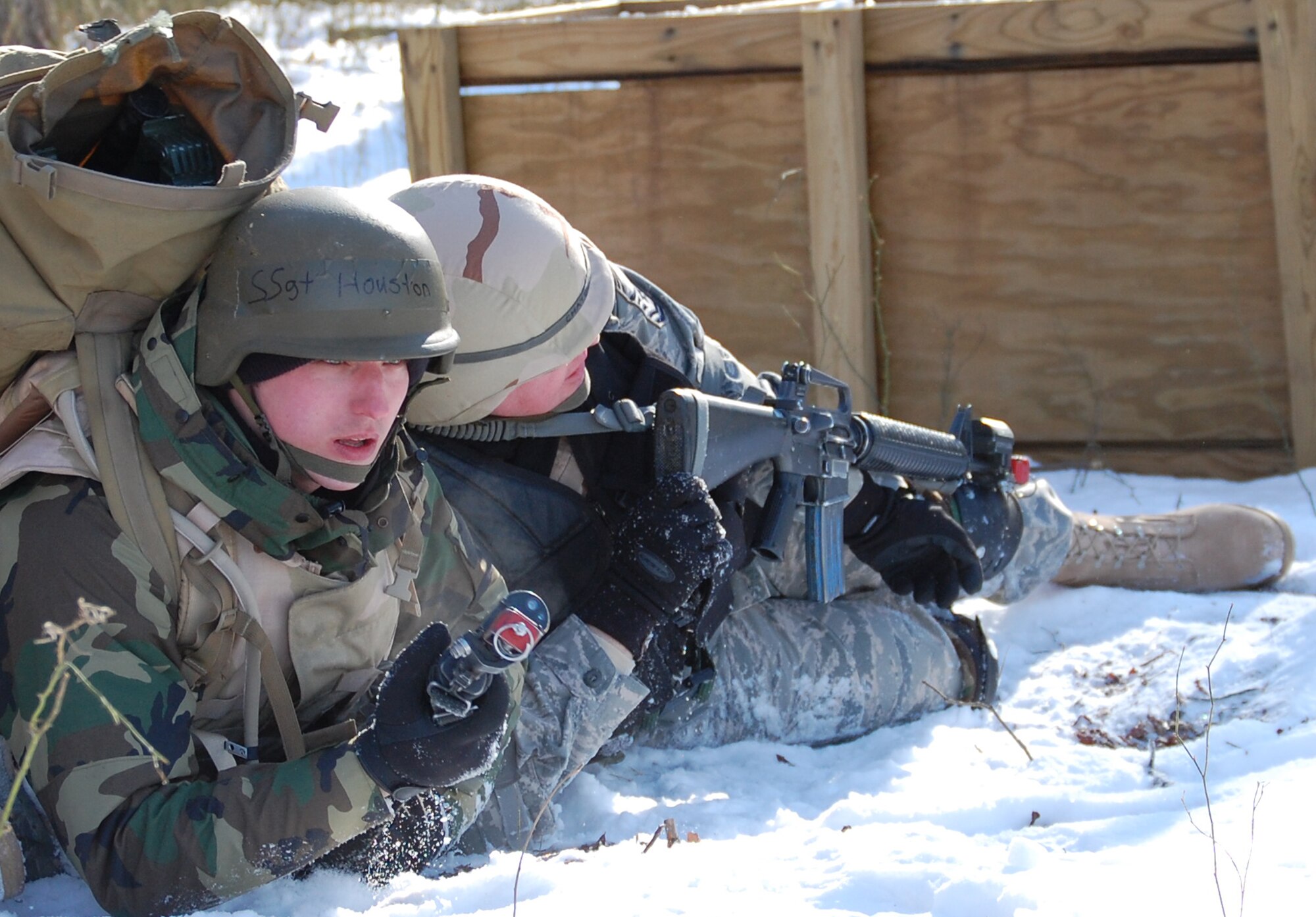 Students in the Advanced Contingency Skills Training Course respond to a scenario during a training session in combat first aid on Feb. 5, 2009, on a Fort Dix, N.J., range.  ACST is taught by the U.S. Air Force Expeditionary Center's 421st Combat Training Squadron and prepares Airmen for upcoming deployments.  (U.S. Air Force Photo/Tech. Sgt. Scott T. Sturkol)