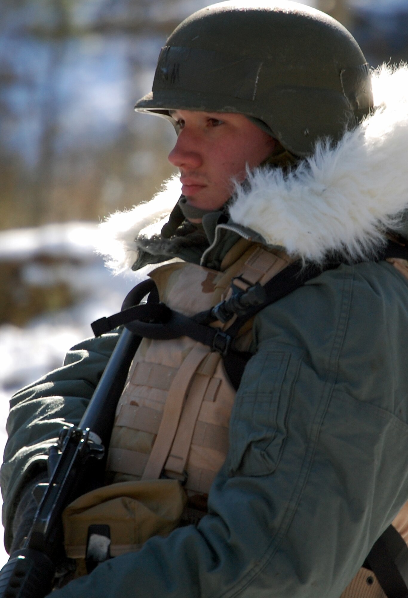 A student in the Advanced Contingency Skills Training Course moves with his squad at the start of a training session in combat first aid Feb. 5, 2009, on a Fort Dix, N.J., range.  ACST is taught by the U.S. Air Force Expeditionary Center's 421st Combat Training Squadron and prepares Airmen for upcoming deployments.  (U.S. Air Force Photo/Tech. Sgt. Scott T. Sturkol)