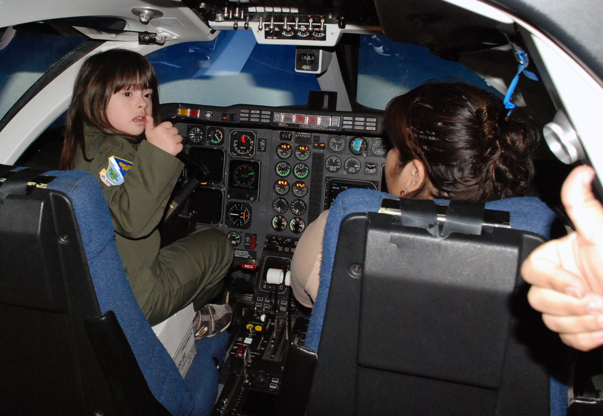 LAUGHLIN AIR FORCE BASE, Texas -- Pilot for a day,Angel del Cielo Aguilar, sits in a simulator that helps pilots learn how to fly different aircraft during tour of Laughlin and her day to be a pilot here recently. (U.S. Air Force photo by Tech. Sgt. Joel Langton)