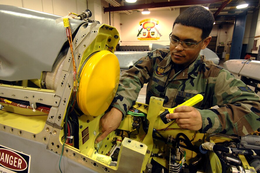 MINOT AIR FORCE BASE, N.D. -- Airman 1st Class Louis Jason Simo, a missile maintenance technician with the 5th Munitions Squadron, works on a missile here Feb. 9, ensuring it is maintained according to the technical orders.  Ensuring missiles are safe, secure and reliable is Airman Simo's number one mission on a day-to-day basis. (U.S. Air Force photo by Senior Airman Kelly Timney)