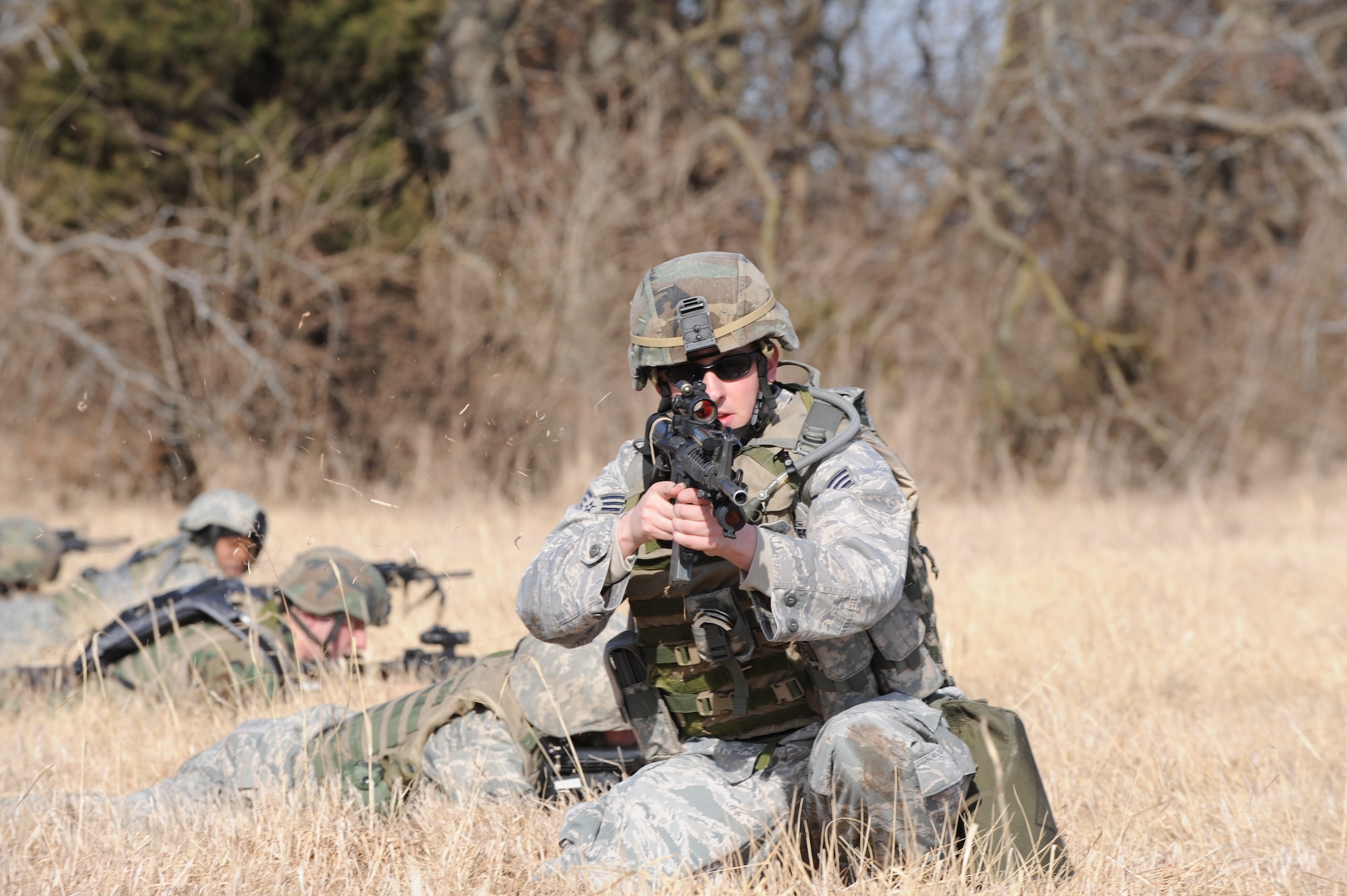 WHITEMAN AIR FORCE BASE, Mo. – Airmen from the 509th Security Forces Squadron provide flank cover before a lateral formation movement at the Cobra training site during the Blue Coach training course  Feb. 6. (U.S. Air Force photo/Staff Sgt Charles Larkin)     