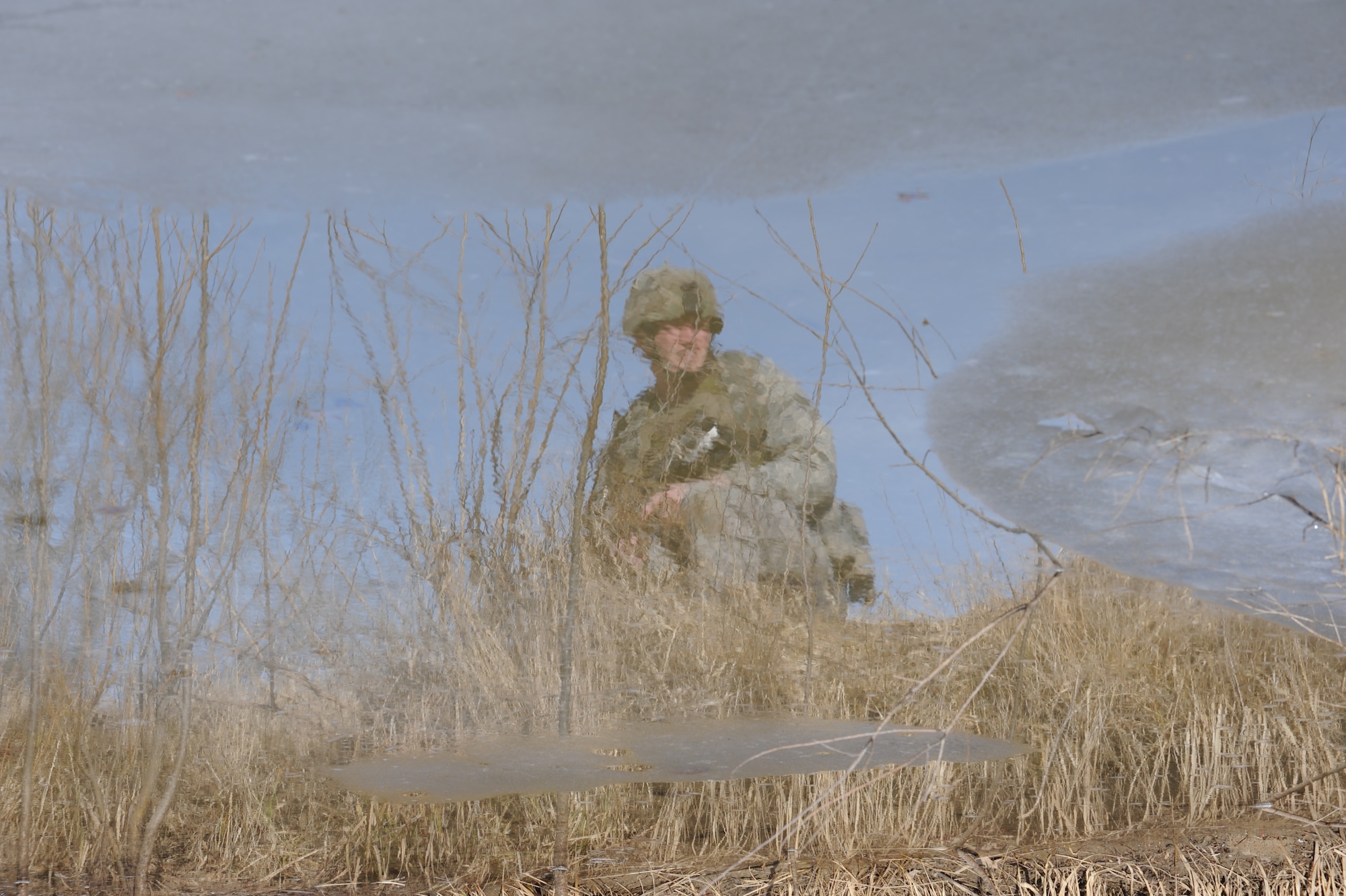 WHITEMAN AIR FORCE BASE, Mo. - Senior Airman Joshua Lancaster, 509th Security Forces Squadron, awaits instruction near a small pool of water during the Blue Coach training initiative  Feb. 6. (U.S. Air Force photo/Staff Sgt. Charles Larkin)
   