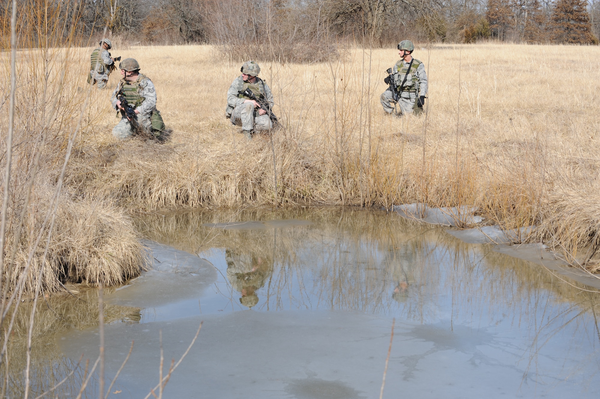 WHITEMAN AIR FORCE BASE, Mo. – Airmen from the 509th Security Forces Squadron await instructions to maneuver team members at the Cobra training site during the Blue Coach training course  Feb. 6. (U.S. Air Force photo/Staff Sgt. Charles Larkin)                                        