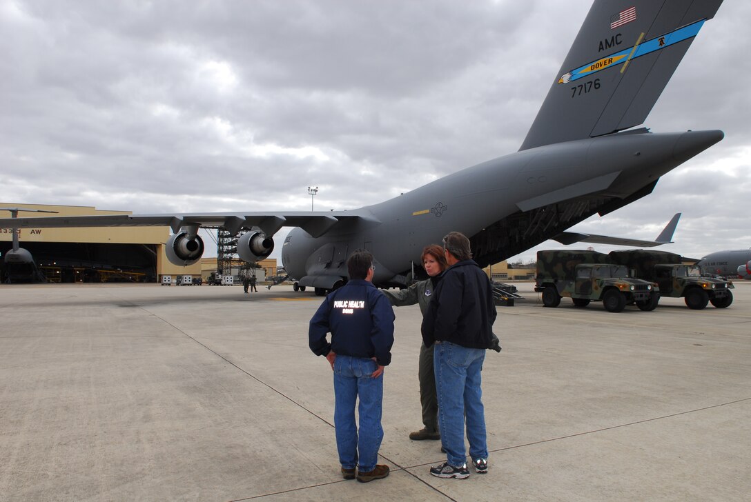 Col. (Dr.) Connie McNabb, Texas Military Forces State Joint Surgeon, speaks with Dr. David Lakey (left), Texas Department of Health Services (DSHS) commissioner, and Rick Bays, DSHS Response and Recovery Unit director, after deplaning from a C-17 aircraft at Lackland Air Force Base, Texas, after an orientation flight Feb. 7. (TXMF photo by Tech. Sgt. Rene Castillo)