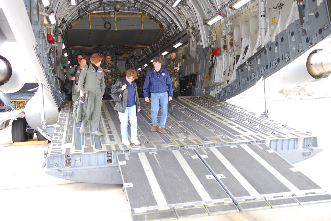 Col. (Dr.) Connie McNabb, Col. (Dr.) Connie McNabb, Texas Military Forces State Joint Surgeon; Evelyn Delgado, Department of State Health Services (DSHS) assistant commissioner for Family Community Health Services; and Dr. David Lakey, DSHS commissioner, deplane after an orientation flight in a C-17 aircraft at Lackland Air Force Base, Texas, Feb. 7. (TXMF photo by Tech. Sgt. Rene Castillo)
