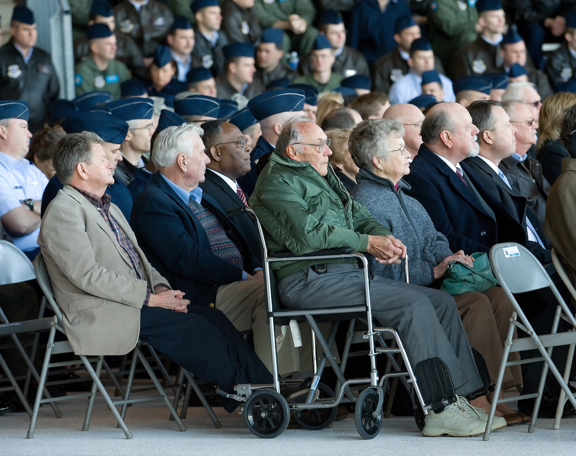 DOVER AIR FORCE BASE, Del. -- Mr. Les Finney, left, Mr. Willie Curtis, in the same row and two seats from Mr. Finney, Mr. Bob Valeski, seated in the wheel chair, and Mr. Tom Dennis, two seats up in the same row as Mr. Valeski, were part of the crew who originally delivered Dover's first C-5A in 1971. The were present Feb. 9 to watch the delivery of Dover's first C-5M, the Spirit of Global Reach. (U.S. Air Force photo/Jason Minto)