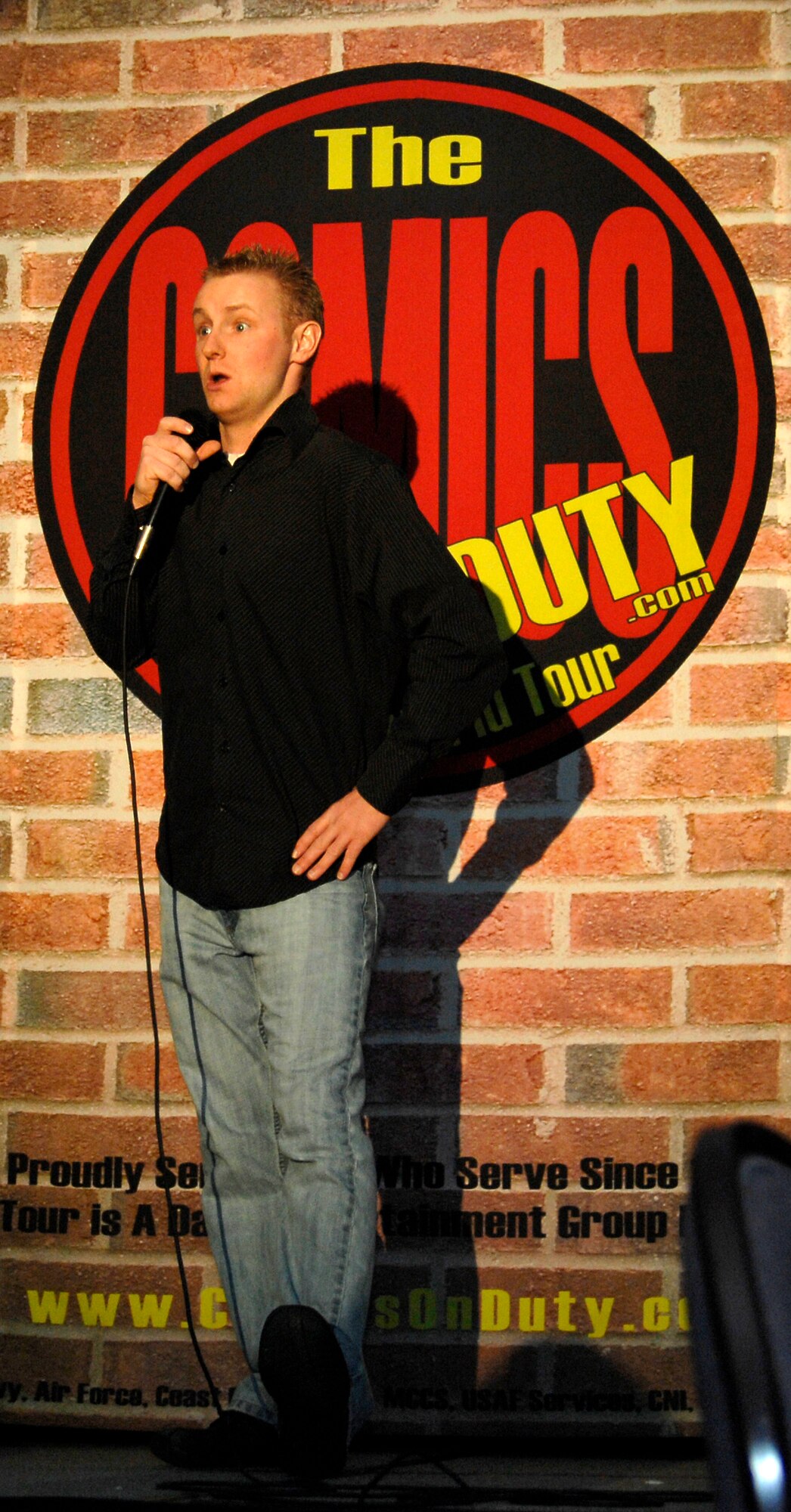 WHITEMAN AIR FORCE BASE, Mo. - Comedian Lucas Bohn entertains a crowd of more than 200 members of Team Whiteman Feb. 6 at the Mission’s End. One of the youngest performers, 26-year-old Bohn provided a laugh filled performance as part of the Comics on Duty World Tour. Comics on Duty began in 1992 and has provided more than 3,500 performances worldwide including Iraq and Afghanistan. (U.S. Air Force photo/Staff Sgt. Jason Barebo)