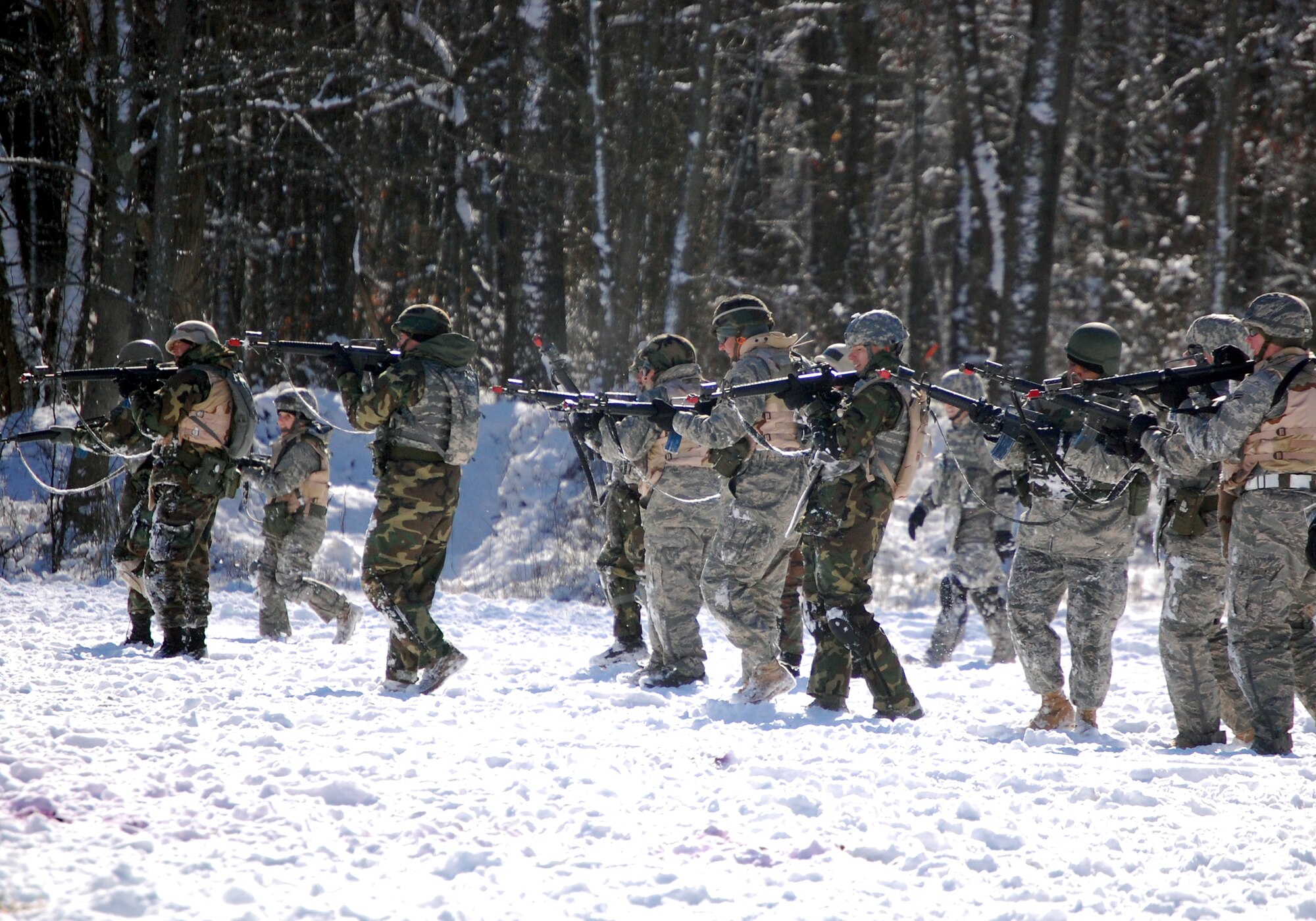 Airmen in the Advanced Contingency Skills Training Course practice a patrolling and tactics response Feb. 4, 2008, during training on a Fort Dix, N.J., range.  The course, taught by the U.S. Air Force Expeditionary Center's 421st Combat Training Squadron, prepares Airmen for upcoming deployments to areas such as Iraq and Afghanistan.  The students learn advanced combat skills in convoy operations, military operations in urban terrain and related training.  (U.S. Air Force Photo/Tech. Sgt. Scott T. Sturkol)