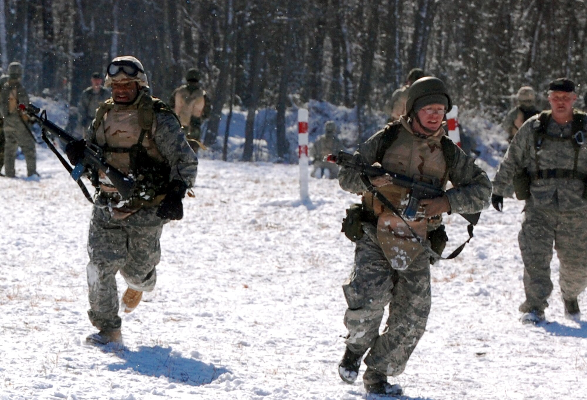 Airmen in the Advanced Contingency Skills Training Course practice a patrolling and tactics response Feb. 4, 2008, during training on a Fort Dix, N.J., range.  The course, taught by the U.S. Air Force Expeditionary Center's 421st Combat Training Squadron, prepares Airmen for upcoming deployments to areas such as Iraq and Afghanistan.  The students learn advanced combat skills in convoy operations, military operations in urban terrain and related training.  (U.S. Air Force Photo/Tech. Sgt. Scott T. Sturkol)