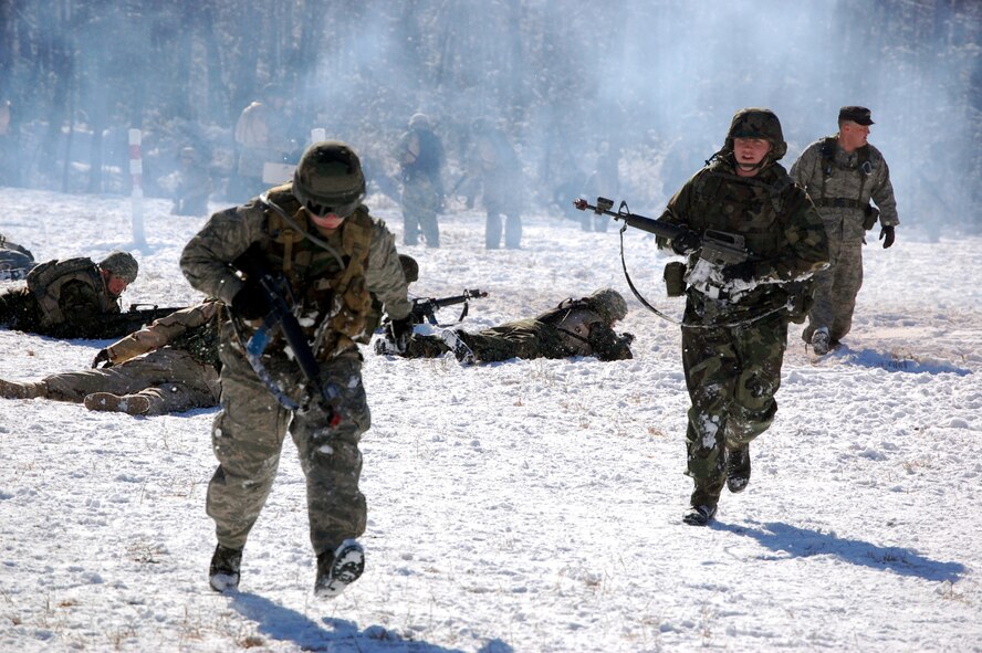 Airmen in the Advanced Contingency Skills Training Course practice a patrolling and tactics response Feb. 4, 2008, during training on a Fort Dix, N.J., range.  The course, taught by the U.S. Air Force Expeditionary Center's 421st Combat Training Squadron, prepares Airmen for upcoming deployments to areas such as Iraq and Afghanistan.  The students learn advanced combat skills in convoy operations, military operations in urban terrain and related training.  (U.S. Air Force Photo/Tech. Sgt. Scott T. Sturkol)