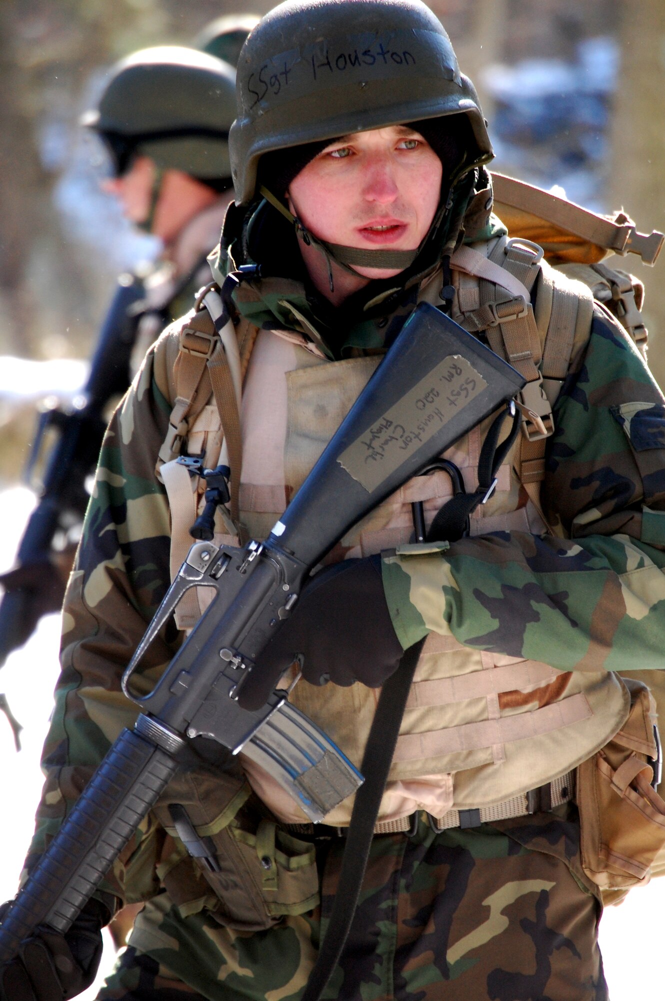 A student in the Advanced Contingency Skills Training Course moves with his squad at the start of a training session in combat first aid Feb. 5, 2009, on a Fort Dix, N.J., range.  ACST is taught by the U.S. Air Force Expeditionary Center's 421st Combat Training Squadron and prepares Airmen for upcoming deployments.  (U.S. Air Force Photo/Tech. Sgt. Scott T. Sturkol)