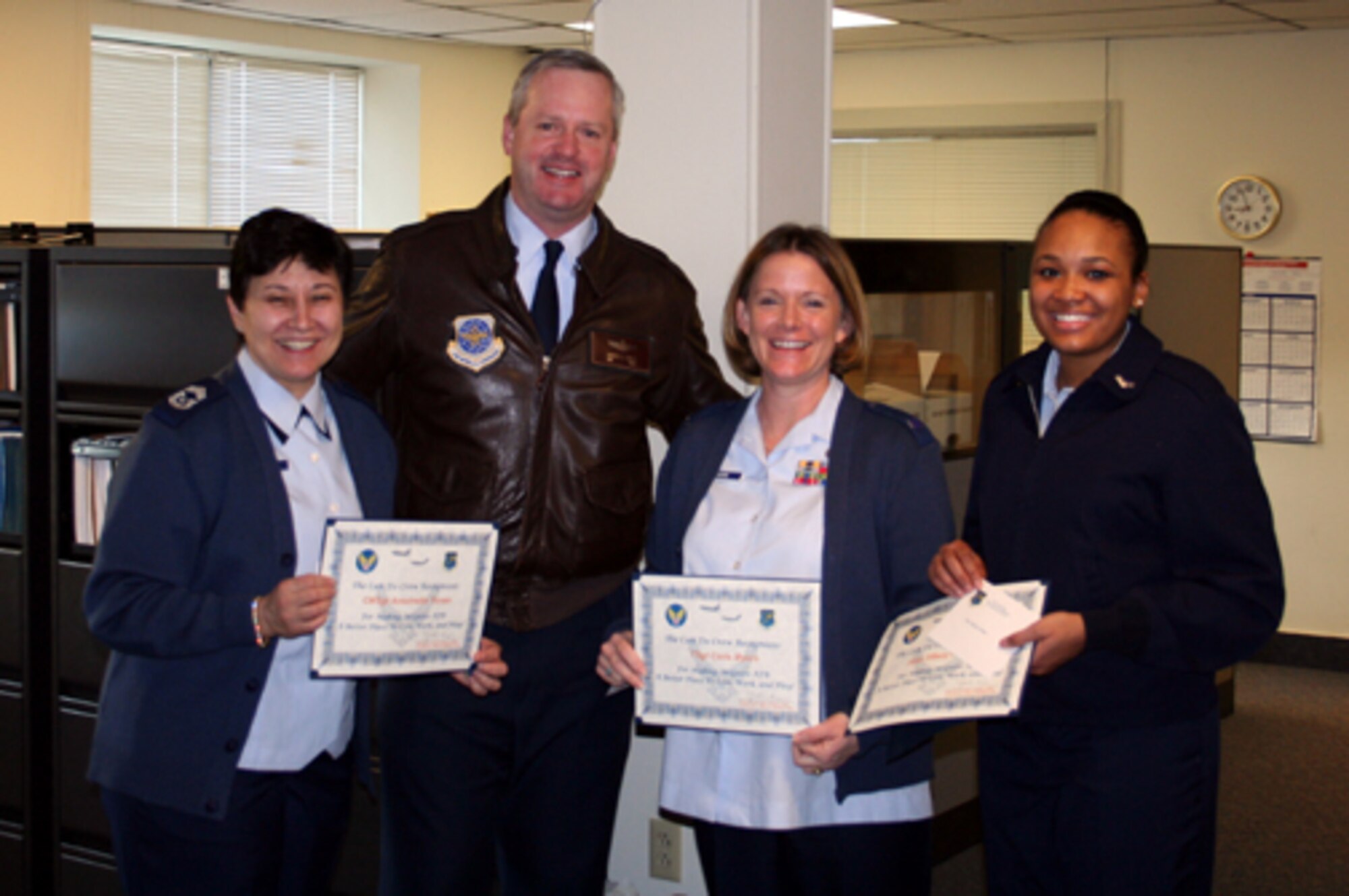 Col. Scott Smith, 305th Air Mobility Wing vice commander, presents the Can Do Crew award to (Left to right,) Chief Master Sgt. Antoinette Yonas, 305th Comptroller Squadron; Tech. Sgt. Carla Myers, 305th CPTS; and Airman 1st Class Tiffany Holmes, 305th CPTS. “When filing his PCS travel voucher, Lt. Col John Price, 6th Airlift Squadron commander, ran into a multitude of administrative hurdles along the way; however, due to the exceptional diligence, expertise, and customer service demonstrated by the team of professionals at McGuire’s finance office, his family’s PCS travel voucher was completed successfully. Throughout the process, Chief Yonas was extremely helpful and ensured all problems were taken care of, Sergeant Myers was the go-to guru, and Airman Holmes was diligent as well as very knowledgeable for her rank. Colonel Price said the process involved multiple visits, including a 1.5-hour voucher marathon, but all of the business was conducted professionally and as quickly as it could have been considering the issues.”

Be aware that the "Can Do Crew" is everywhere, looking for outstanding service.  They covertly seek members of Team McGuire who make a difference, identifying and recognizing only the best! Remember, the strongest asset of Team McGuire is its people; you are what makes McGuire a better place to live, work and play!