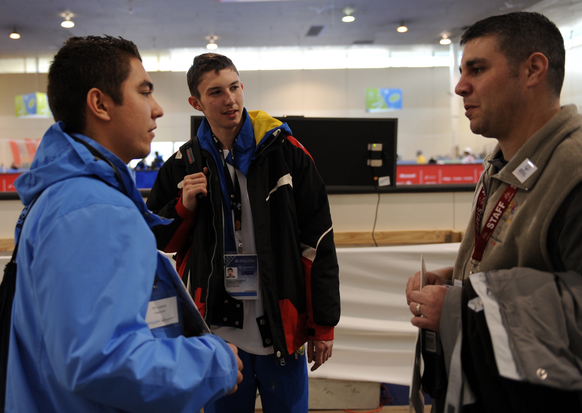 BOISE, Idaho – Tech. Sgt. Jeremy Smiley (right), 366th Logistics Readiness Squadron, talks to Rustam Bolderev (left), a 17-year-old Olympian from Kazakhstan, through his interpreter, Bobur Mirakhmedov from Uzbekistan, during the floor hockey event of the 2009 Special Olympics World Winter Games at the Boise Fairgrounds in Boise, Idaho. Many members of the 366th Fighter Wing have volunteered to help the athletes at event sites in Boise, McCall, Idaho, and Sun Valley, Idaho. (U.S. Air Force photo/ Airman 1st Class Ashley Tank)