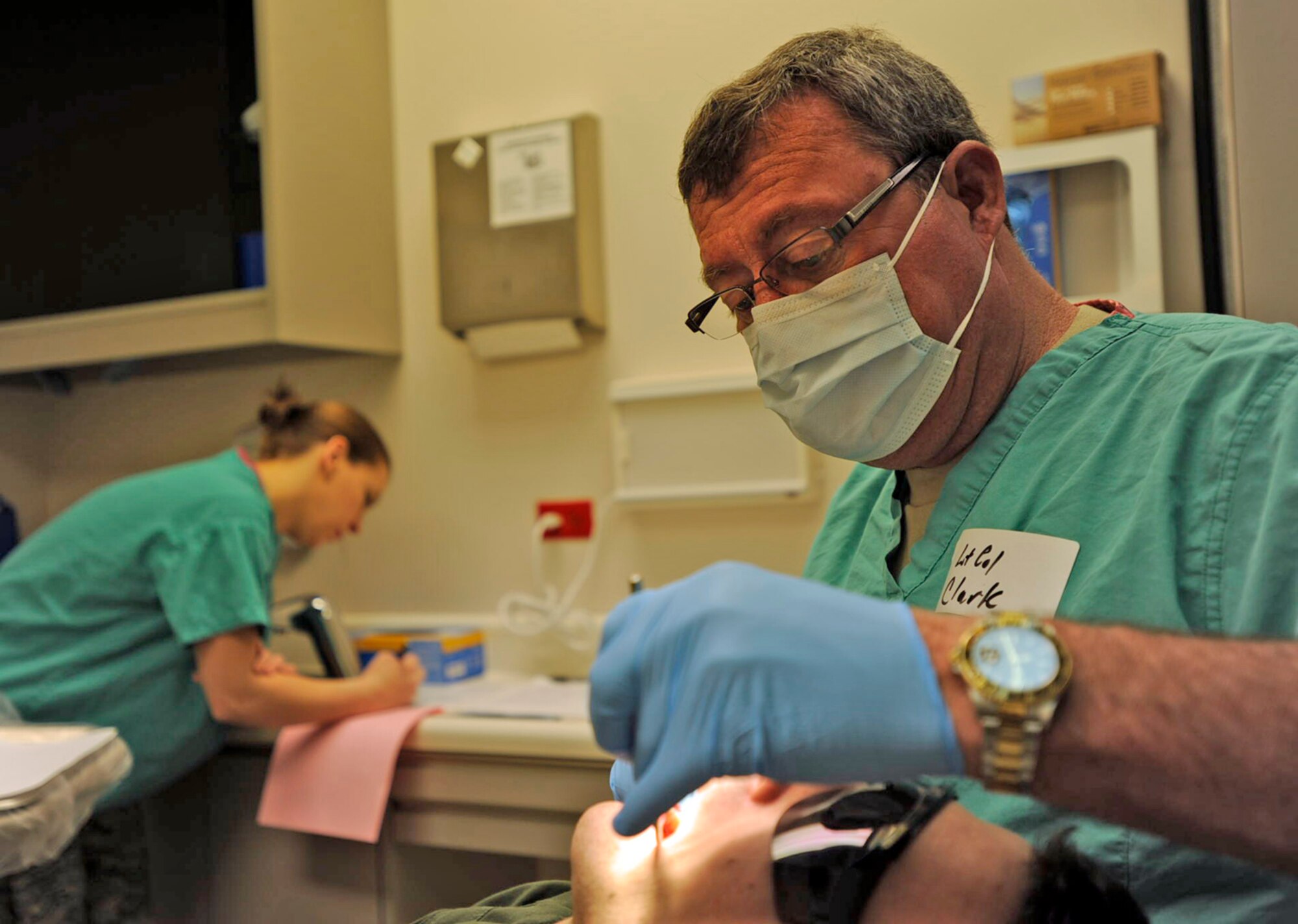 Lt. Col. (Dr.) James Clark examines the teeth of an Airman during the 931st Air Refueling Group's drill weekend in February. Colonel Clark is a dentist assigned to the 931st Aerospace Medicine Flight. He and his flight commander, Lt. Col. Cheryl Hooper, volunteered for Operation Arctic Care, a humanitarian aid mission in Alaska. The 931st is an Air Force Reserve unit at McConnell Air Force Base, Kan. (U.S. Air Force photo/Tech. Sgt. Jason Schaap)