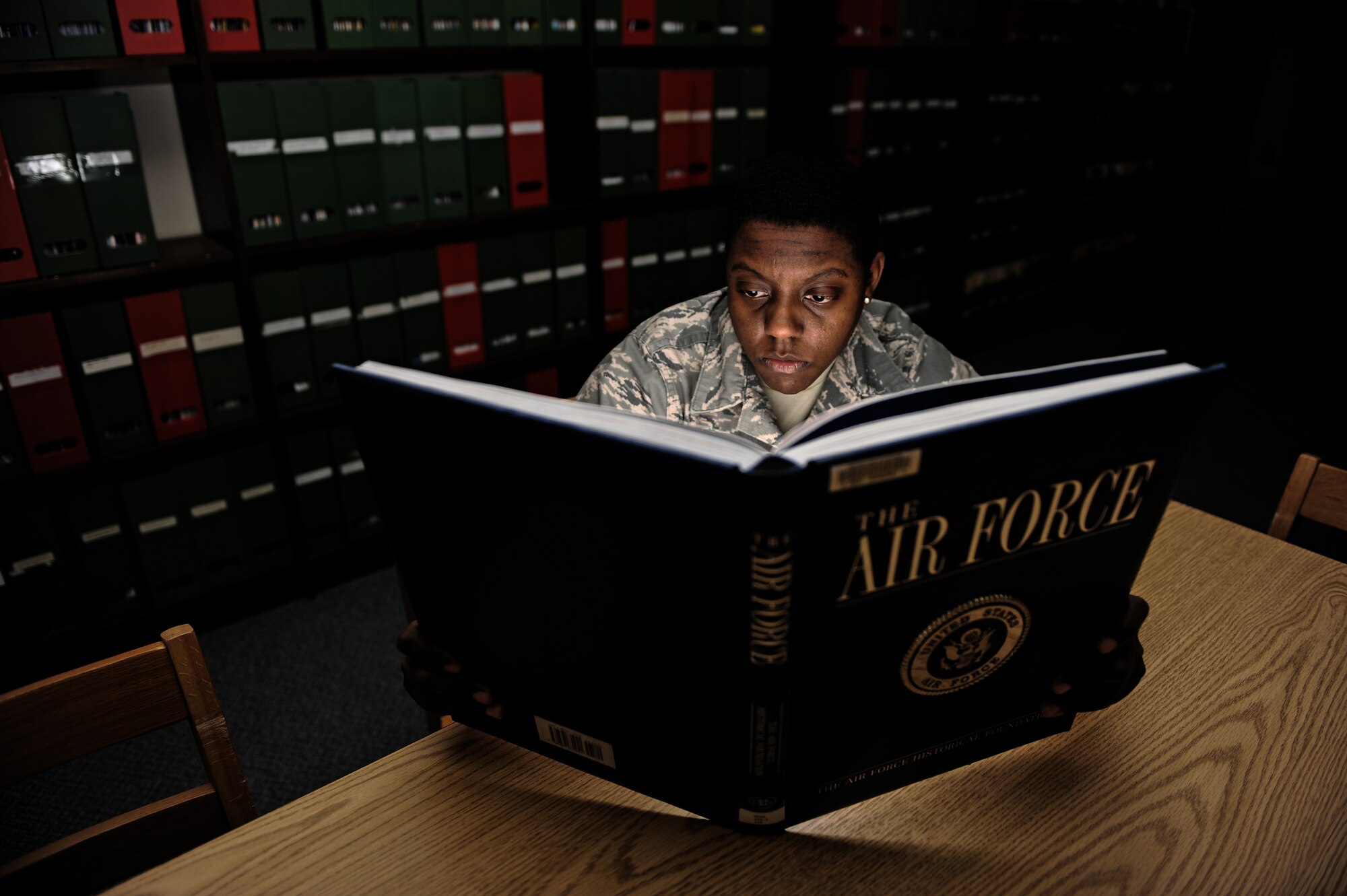 MOUNTAIN HOME AIR FORCE BASE, Idaho -- Airman 1st Class Renishia Richardson, 366th Fighter Wing public affairs, reads about the history of the Air Force at the base library Jan 28. The base library offers numerous services to military members and their families in the form of books, movies, internet access and children’s story time. (U.S. Air Force photo/ Senior Airman Ryan Crane)