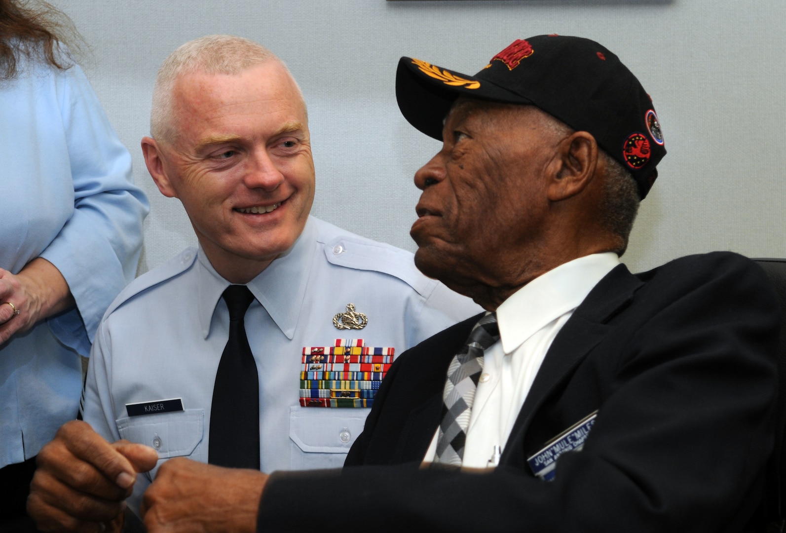 John "Mule" Miles, a Tuskegee Airman aircraft mechanic and former Negro Baseball League Chicago American "Giants" baseball player, speaks with Chief Master Sgt. Andy Kaiser, Air Force Personnel Center command chief master sergeant, during the First Tuskegee Heritage Breakfast Feb. 9 at the 99th Flying Training Squadron. Activated on March 22, 1941, the 99th FTS was originally designated as the 99th Pursuit Squadron, and was better known as the "Tuskegee Airmen," the first all-black unit in the U.S. Army Air Corps. (U.S. Air Force photo by Rich McFadden)