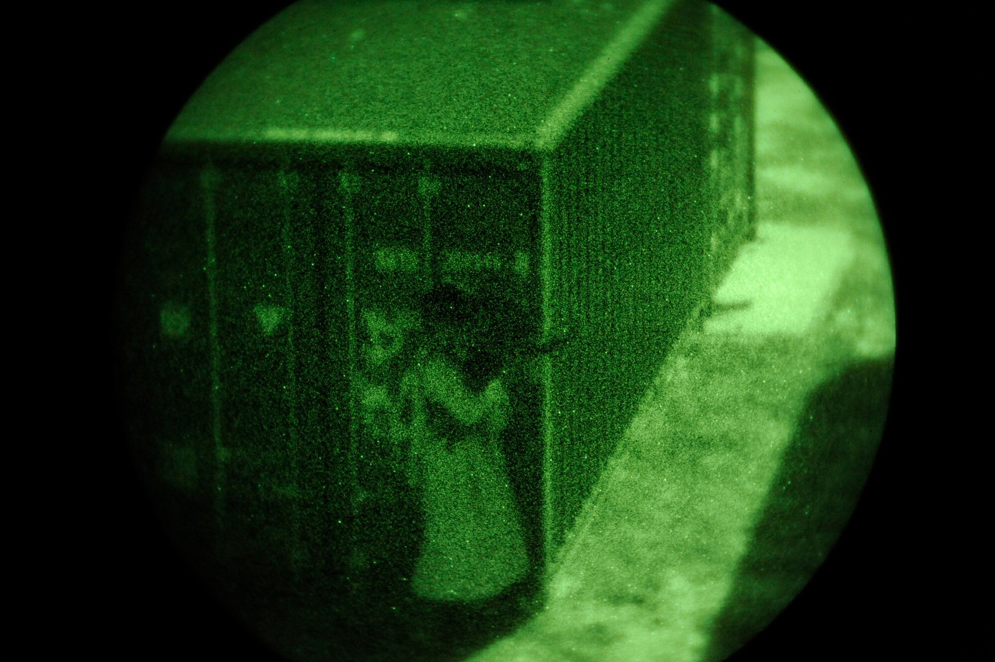 An "enemy" role player takes cover while engaging a quick reaction force Feb. 9 during an Emerald Warrior Exercise training scenario. Air Force Special Operations Command officials are hosting Emerald Warrior to train forces in combat scenarios. The exercise runs until Feb. 13. (U.S. Air Force photo/Staff Sgt. Desiree N. Palacios)