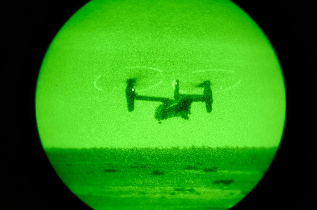 A CV-22 Osprey takes off after deploying a quick reaction force Feb. 9 during an Emerald Warrior Exercise training scenario. The quick reaction force will advance forward to identify where enemy fire came from and engage. Air Force Special Operations Command officials are hosting Emerald Warrior to train forces in combat scenarios. The exercise runs until Feb. 13. (U.S. Air Force photo/Staff Sgt. Desiree N. Palacios)