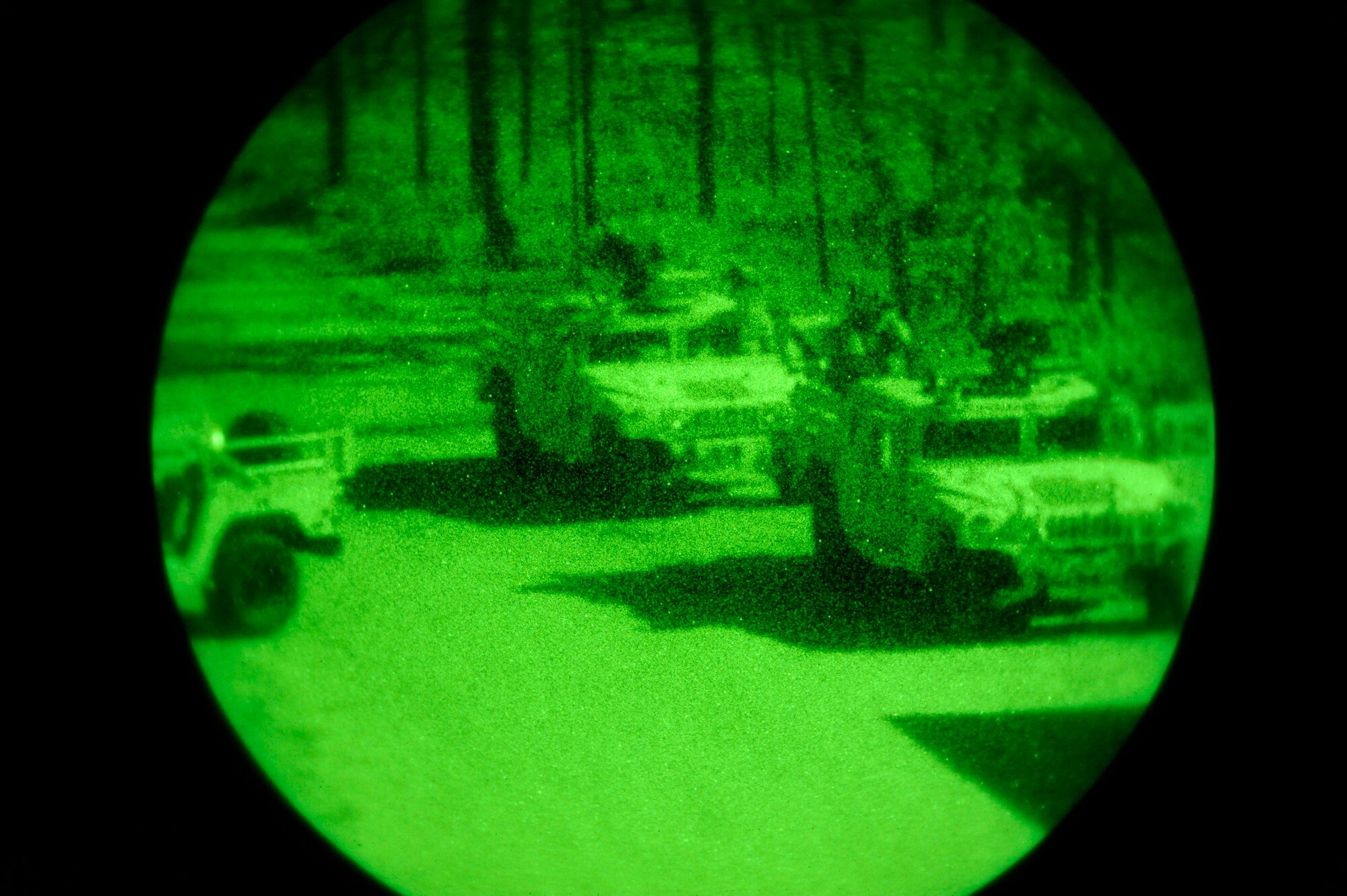 A military quick reaction force arrives in HUMMVEEs Feb. 9 to engage "enemy forces" during an Emerald Warrior Exercise training scenario. Air Force Special Operations Command officials are hosting Emerald Warrior to train forces in combat scenarios. The exercise runs until Feb. 13. (U.S. Air Force photo/Staff Sgt. Desiree N. Palacios)