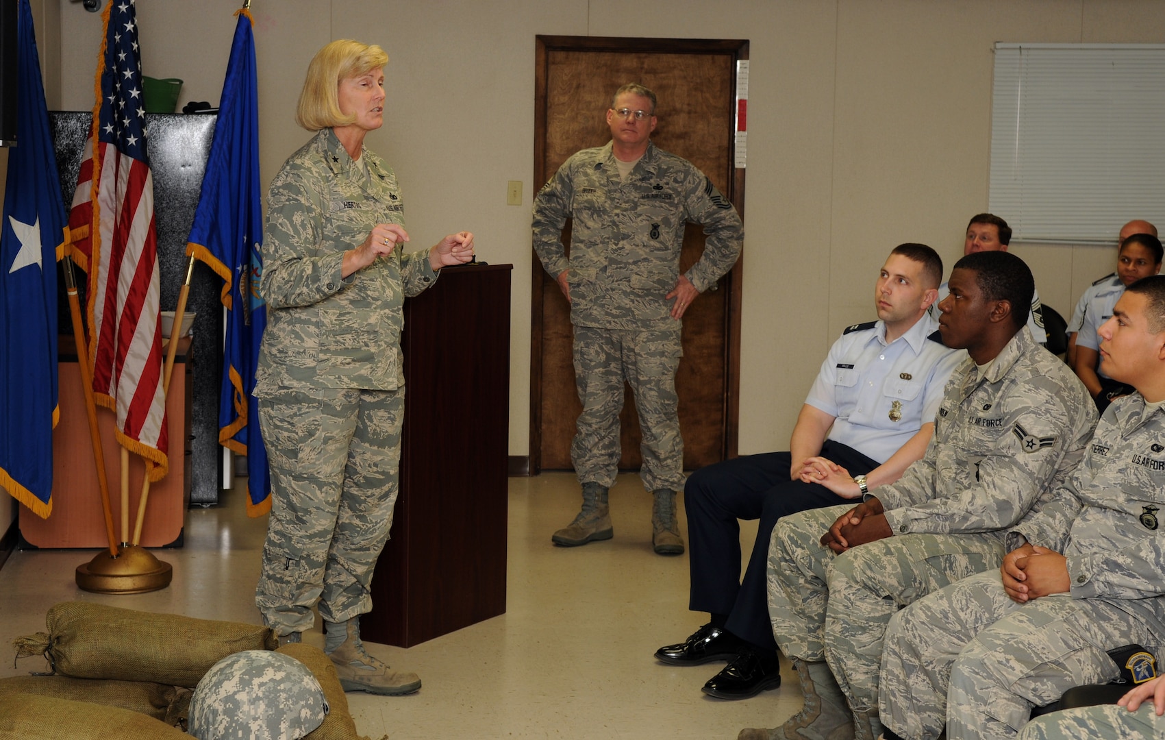 Brig. Gen. Mary Kay Hertog (left), Air Force security forces director, talks with 12th Security Forces Squadron Airmen during a visit to Randolph Air Force Base Feb. 9. General Hertog and Chief Master Sgt. Bruce Broder (center), the security forces career-field manager, toured the squadron and discussed the general's vision with fellow security forces members before heading out to learn about the 12th SFS military working dog and combat arms flights. (U.S. Air Force photo by Rich McFadden)