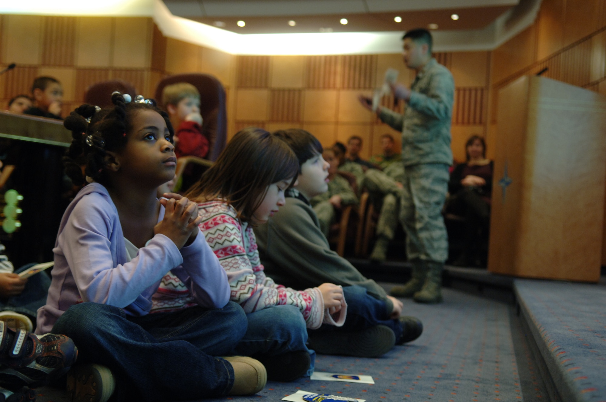 School children listen to a briefing about the history and mission of the U.S. Air Forces in Europe during Job Shadow Day Feb. 5, 2009, at Ramstein Air Base. Job Shadow Day is a nationwide effort to introduce young people to the working community through active participation.(U.S. Air Force photo by Senior Airman Levi Riendeau)