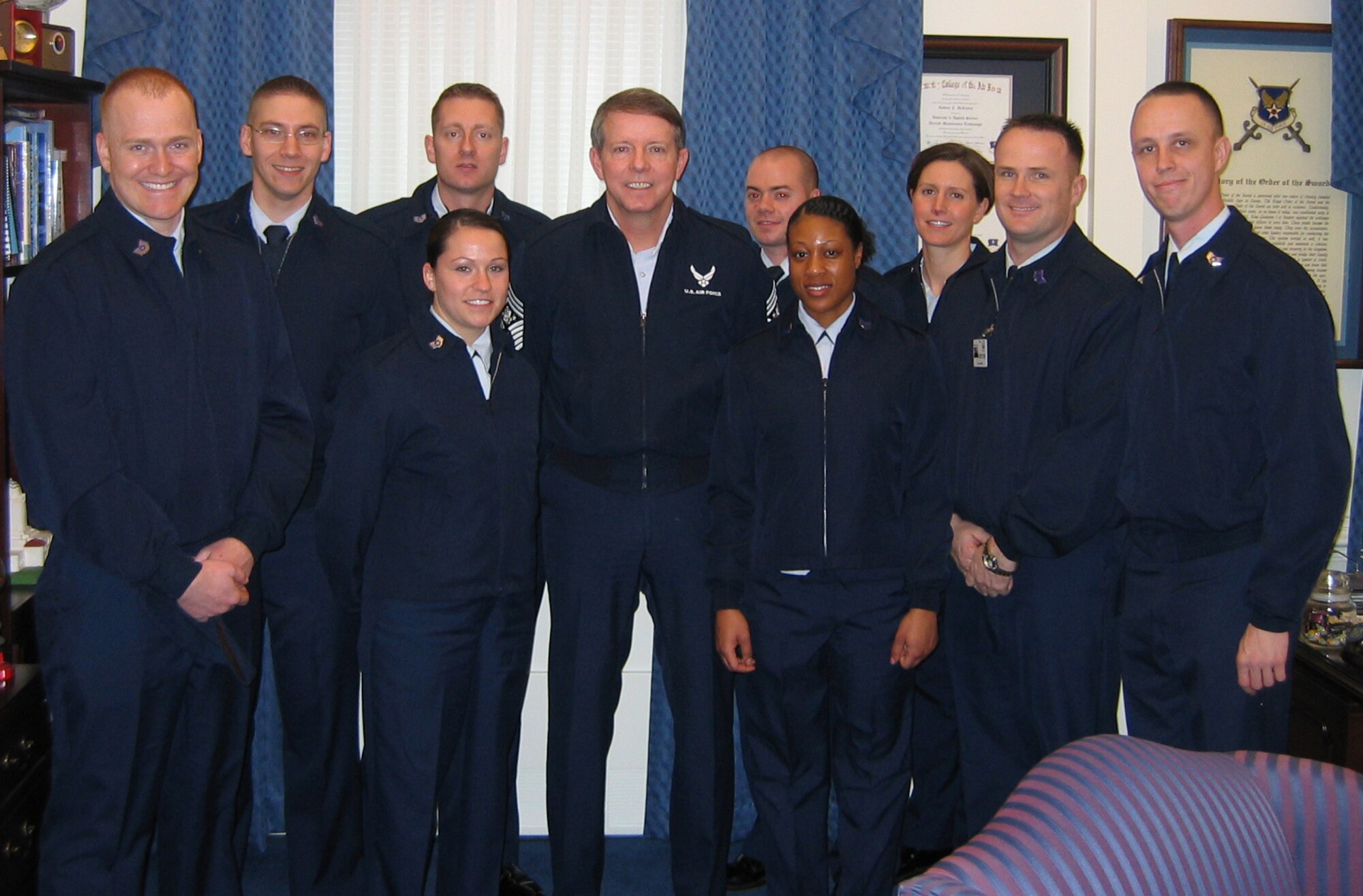 (Left to right) Tech. Sgt. Clayton Chote, Staff Sgt. David Milcarek, Staff Sgt. David Meir, Staff Sgt. Teleah Adkins, Staff Sgt. David Toth, Staff Sgt. Carma McCall, Tech. Sgt. Sarah Lachoney, Tech. Sgt. Steven Miller and Staff Sgt. Gilber Denfield, meet the Chief Master Sgt. of the Air Force, Rodney J. McKinley, in the Pentagon after participating in President Obama’s inaugural parade. Sergeant Miller is assigned to the 736th Aircraft Maintenance Squadron on Dover Air Force Base and wase hand picked to help coordinate and orchestrate the timing functions of the parade. (Courtesy photo)