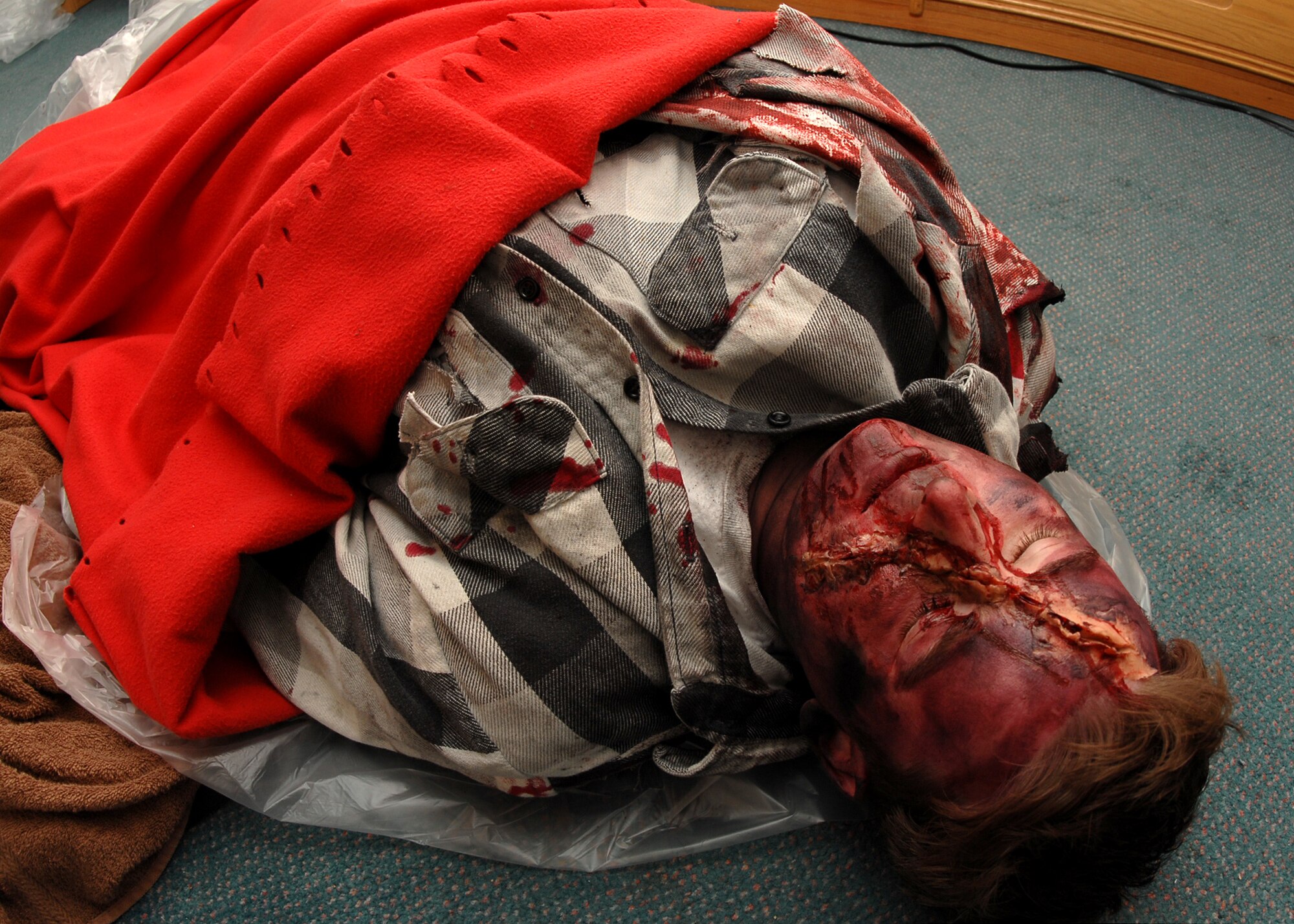 SPANGDAHLEM AIR BASE, Germany -- Senior Airman Jared Smith, 52nd Dental Squadron, is a simulated casualty during an exercise Jan. 29, 2009.  The Emergency Management Major Accident War Trophy Munition exercise trains military personnel for real-life situations by testing the base’s response skills and capabilities. (U.S. Air Force photo by Airman 1st Class Nicholas Wilson) 