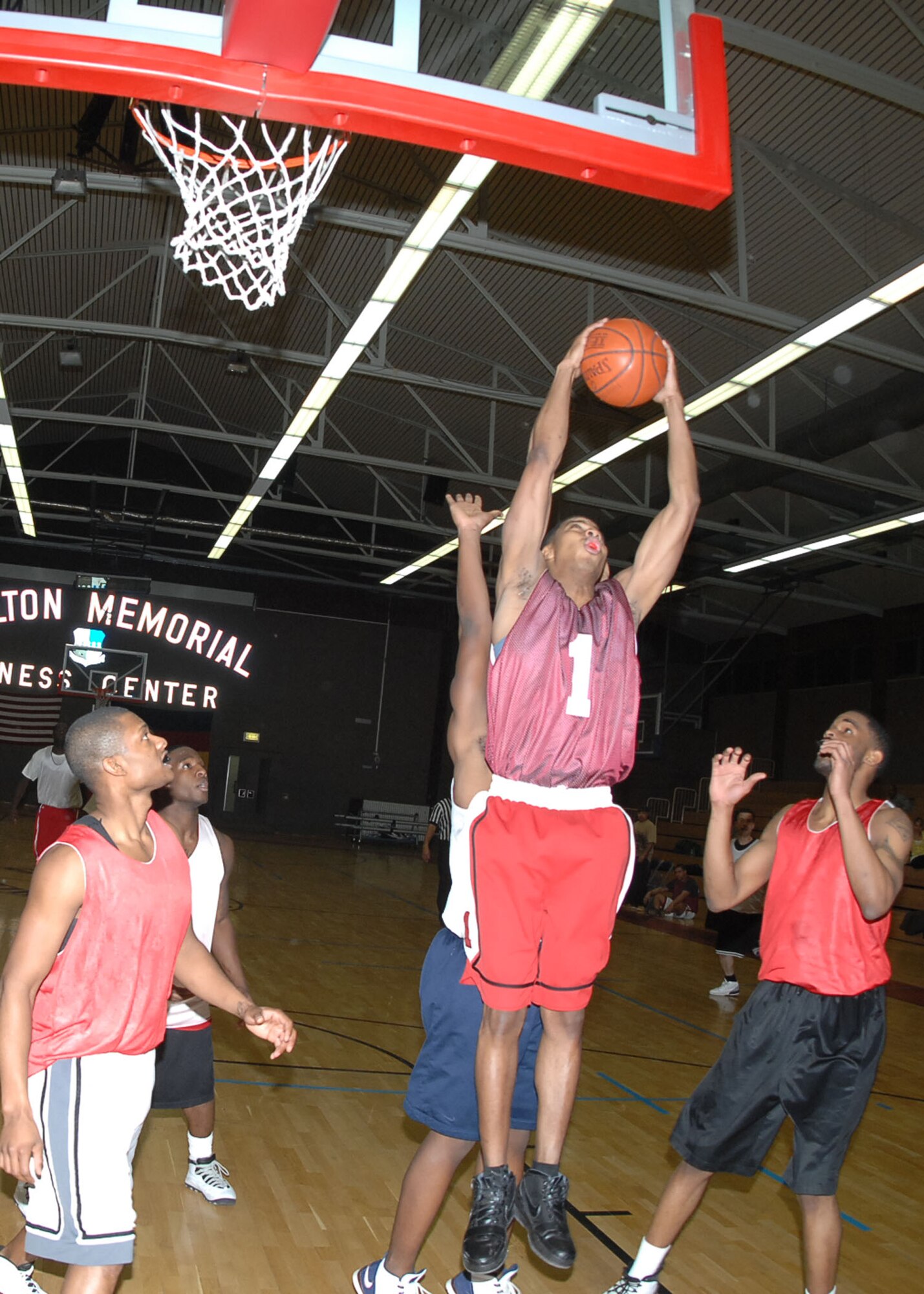 SPANGDAHLEM AIR BASE, Germany -- Staff Sgt. Chonsae Howard, 52 Communications Squadron, evades a Security Forces Squadron defender during an intramural playoff game Jan. 29, 2009. The 52nd CS defeated the 52nd SFS with a score of 53-44 to advance in the tournament. (U.S. Air force photo by Airman 1st Class Nicholas Wilson)