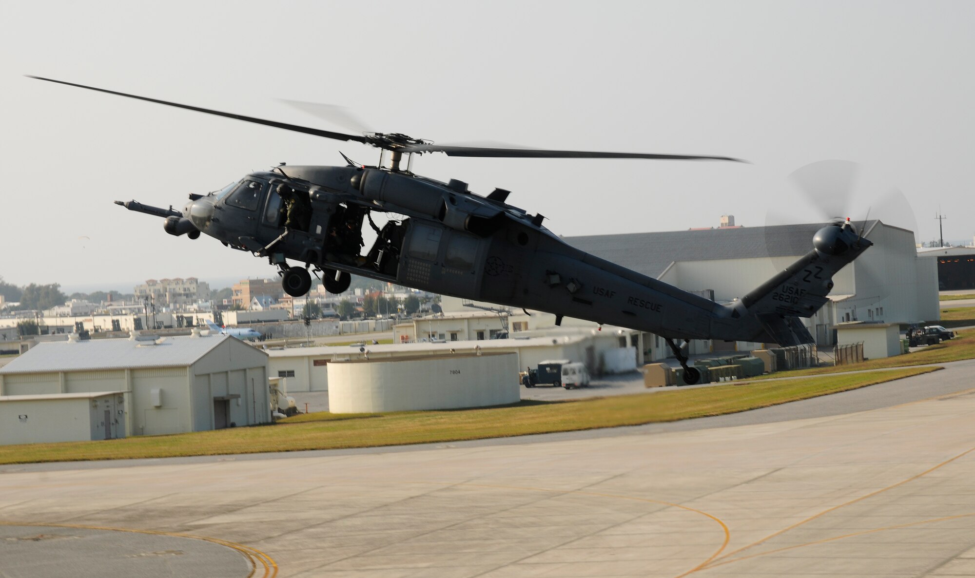 An HH-60 Pave Hawk prepares to land after an air refueling mission off the Coast of Okinawa, Japan as part of exercise Cope Angel 09-1. Cope Angel is a joint rescue exercise between members of the U.S. Air Force and the Japanese Air Self Defense Force. (U.S. Air Force photo/Airman 1st Class Chad Warren)