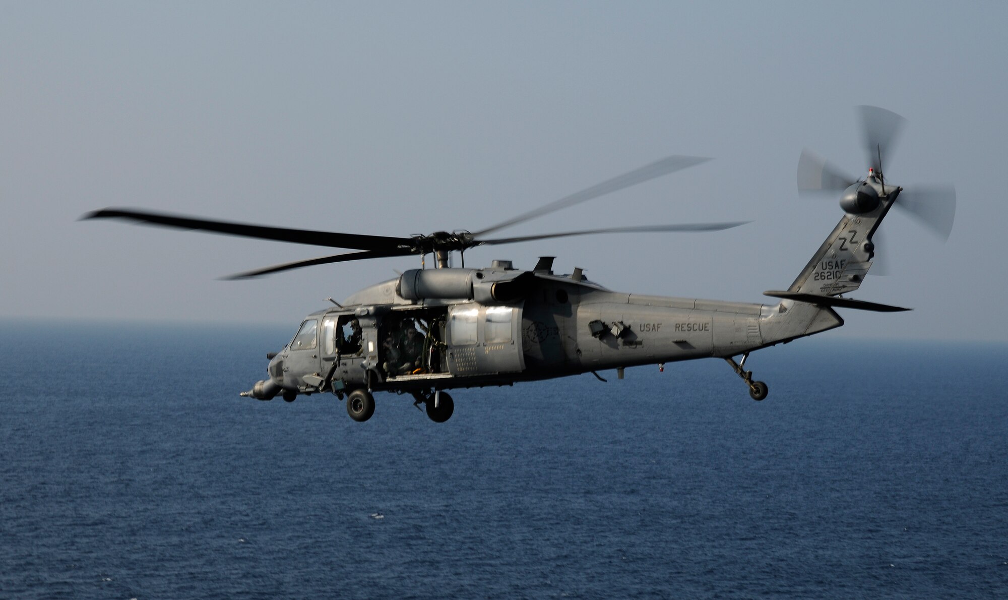 An HH-60 Pave Hawk flies off the Coast of Okinawa, Japan as part of exercise Cope Angel 09-1. Cope Angel is a joint rescue exercise between members of the U.S. Air Force and the Japanese Air Self Defense Force. (U.S. Air Force photo/Airman 1st Class Chad Warren)